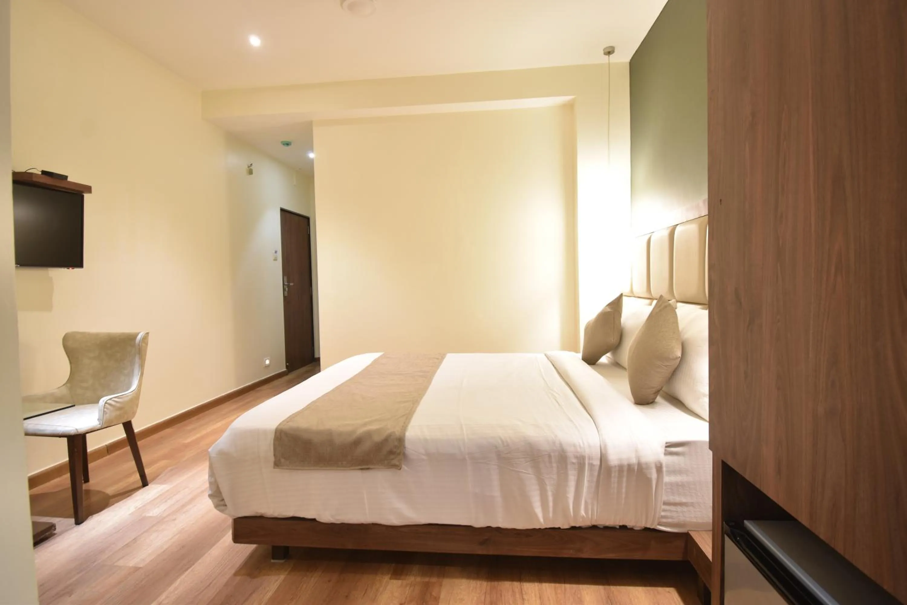Bed in The Aarya A Smart Business Hotel