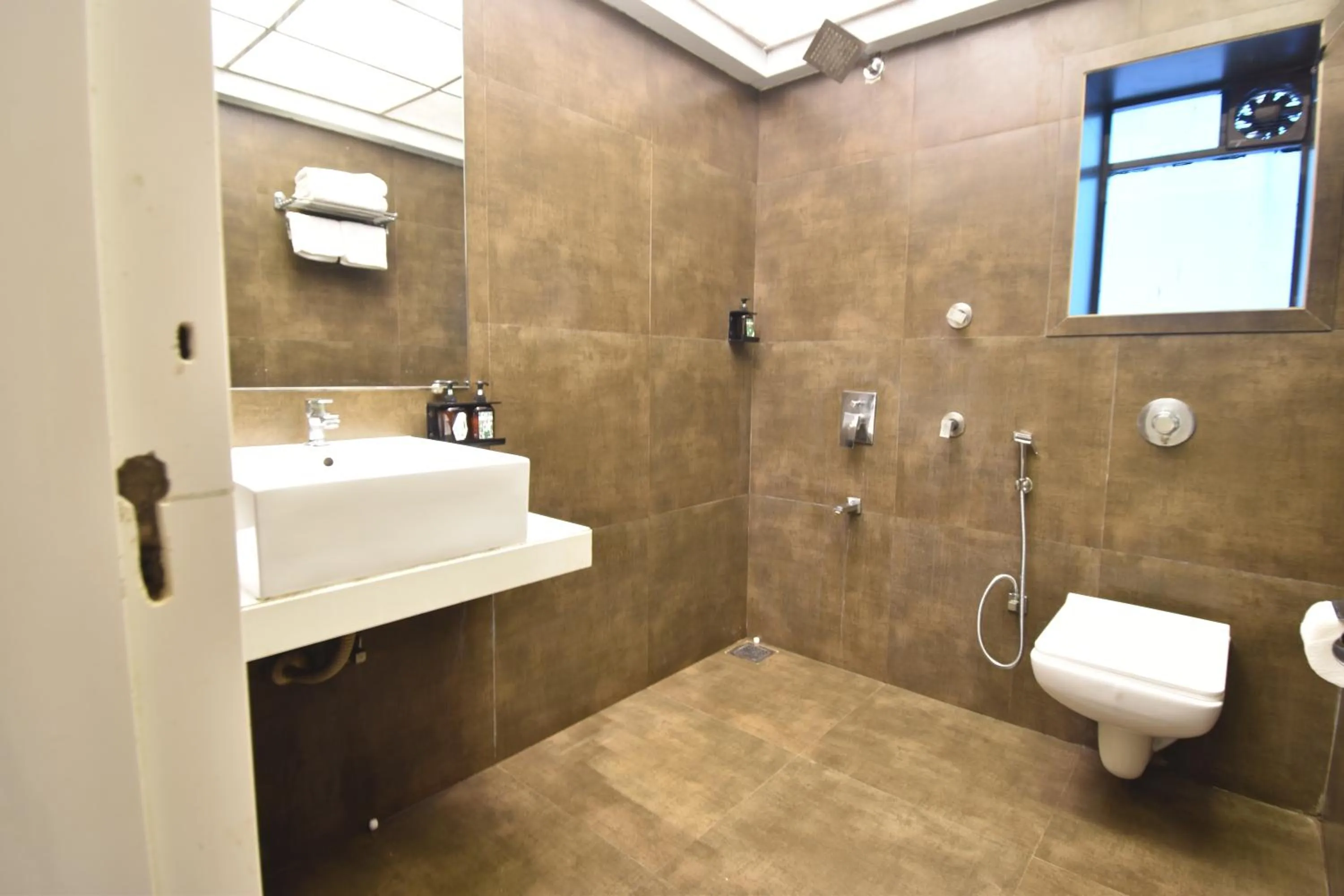 Bathroom in The Aarya A Smart Business Hotel