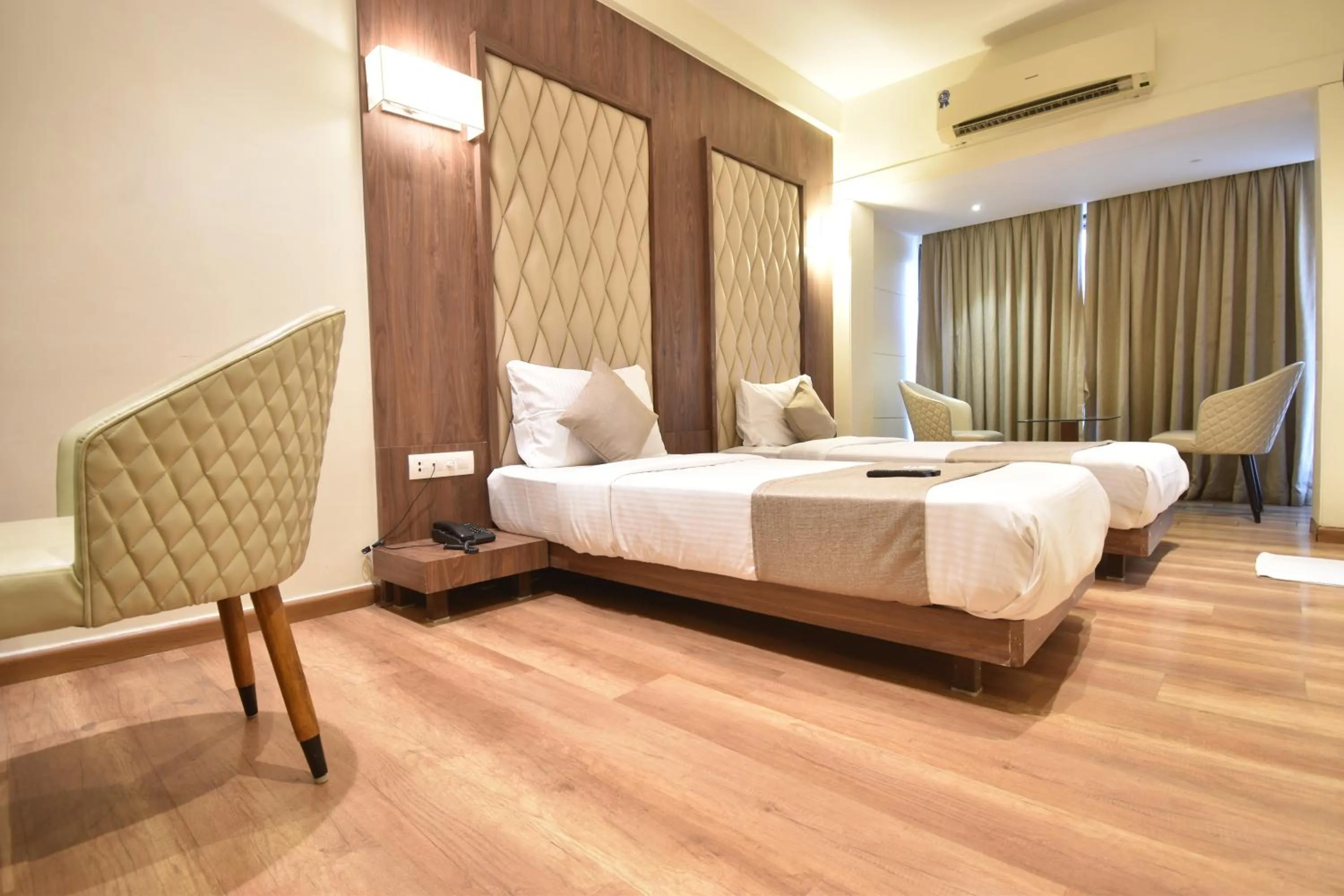 air conditioner, Bed in The Aarya A Smart Business Hotel