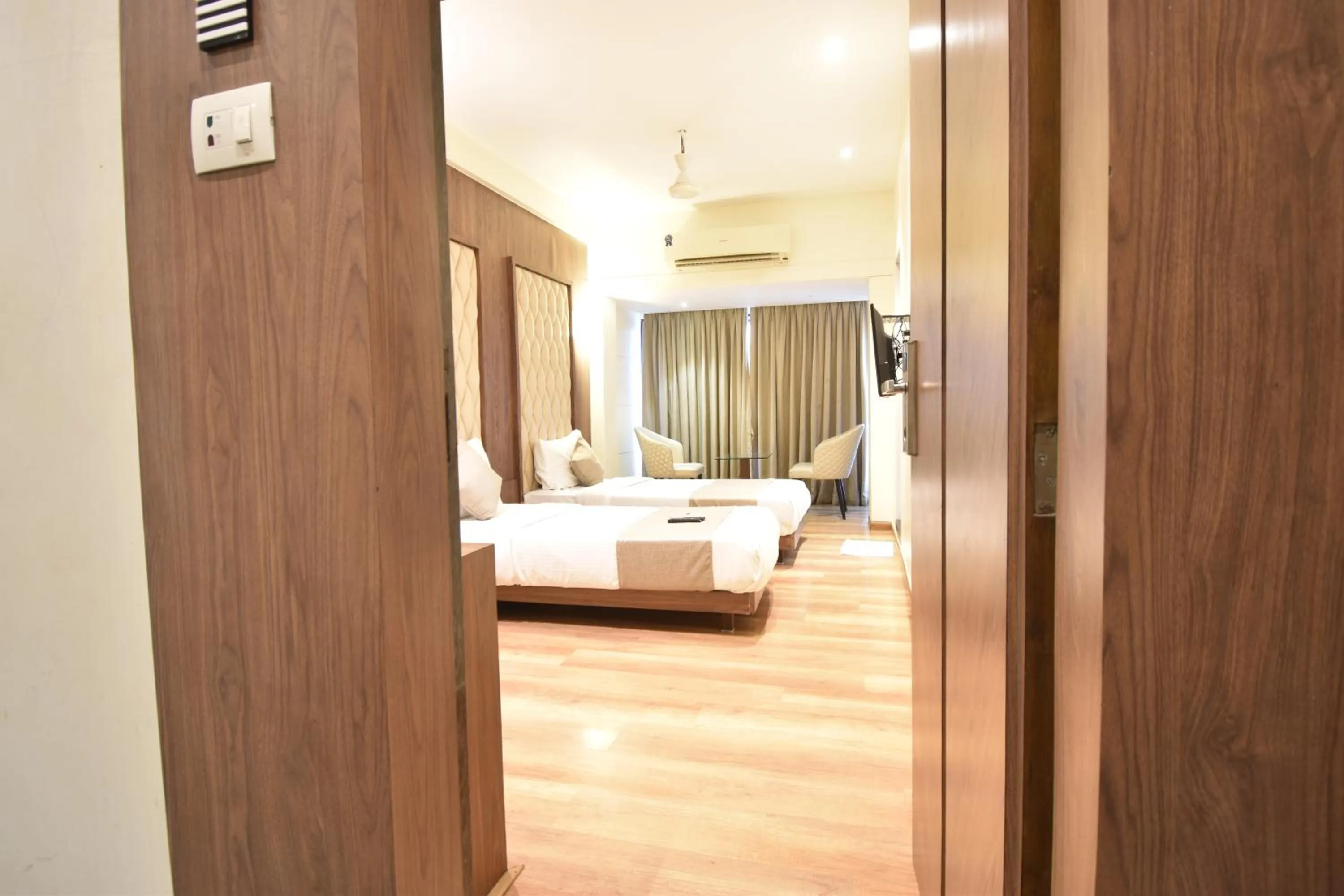 air conditioner, Bed in The Aarya A Smart Business Hotel