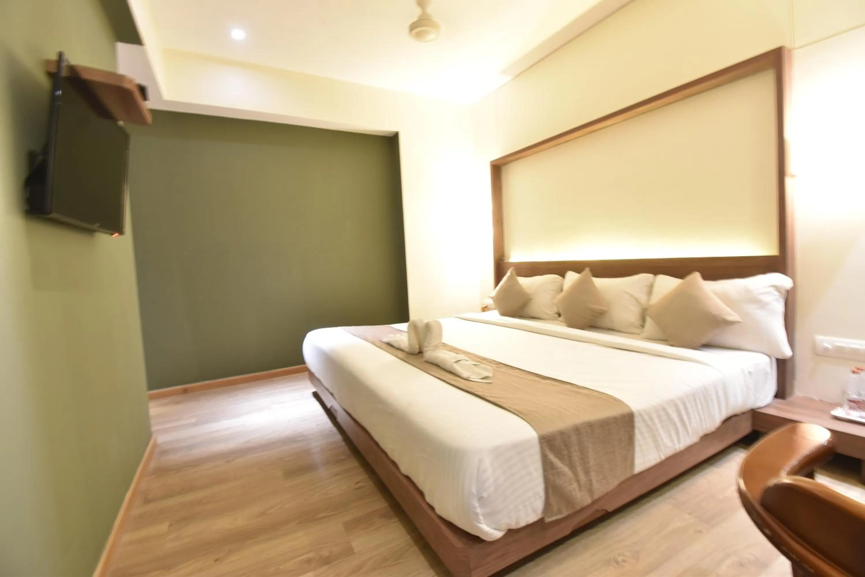 Bed in The Aarya A Smart Business Hotel