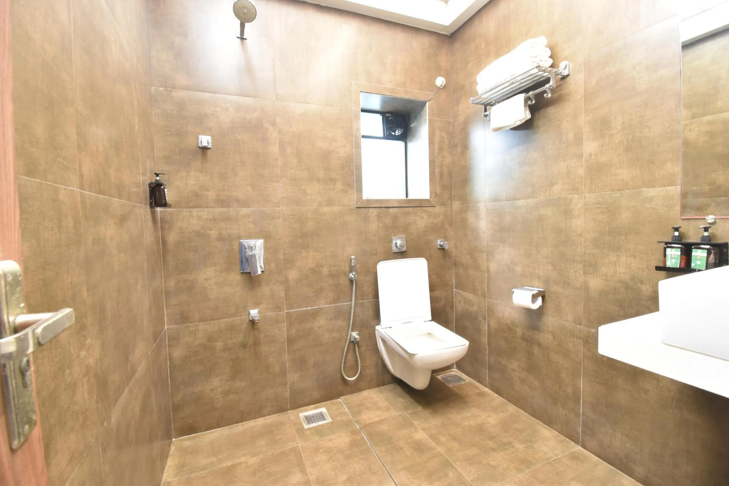 Toilet in The Aarya A Smart Business Hotel