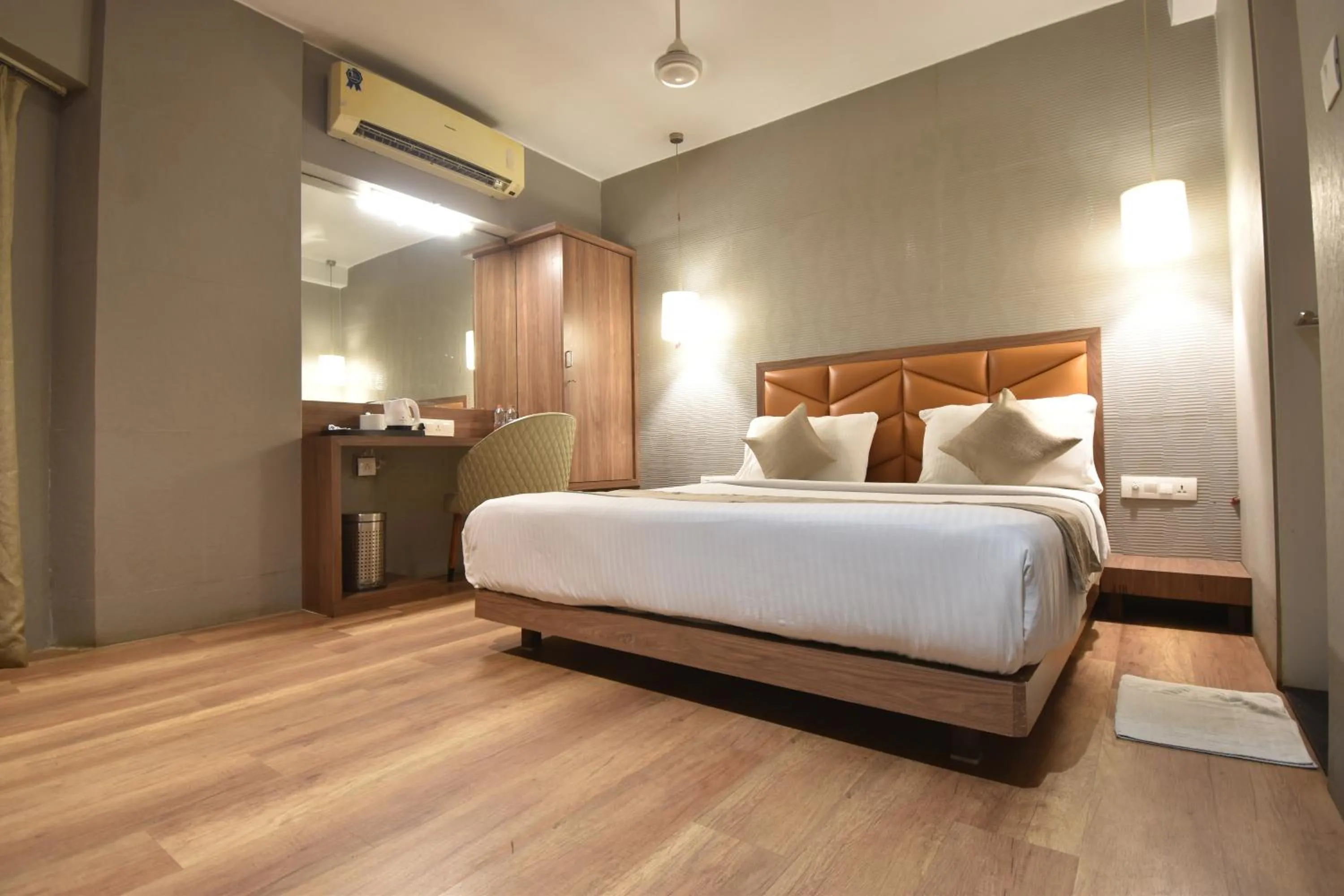 Bed in The Aarya A Smart Business Hotel