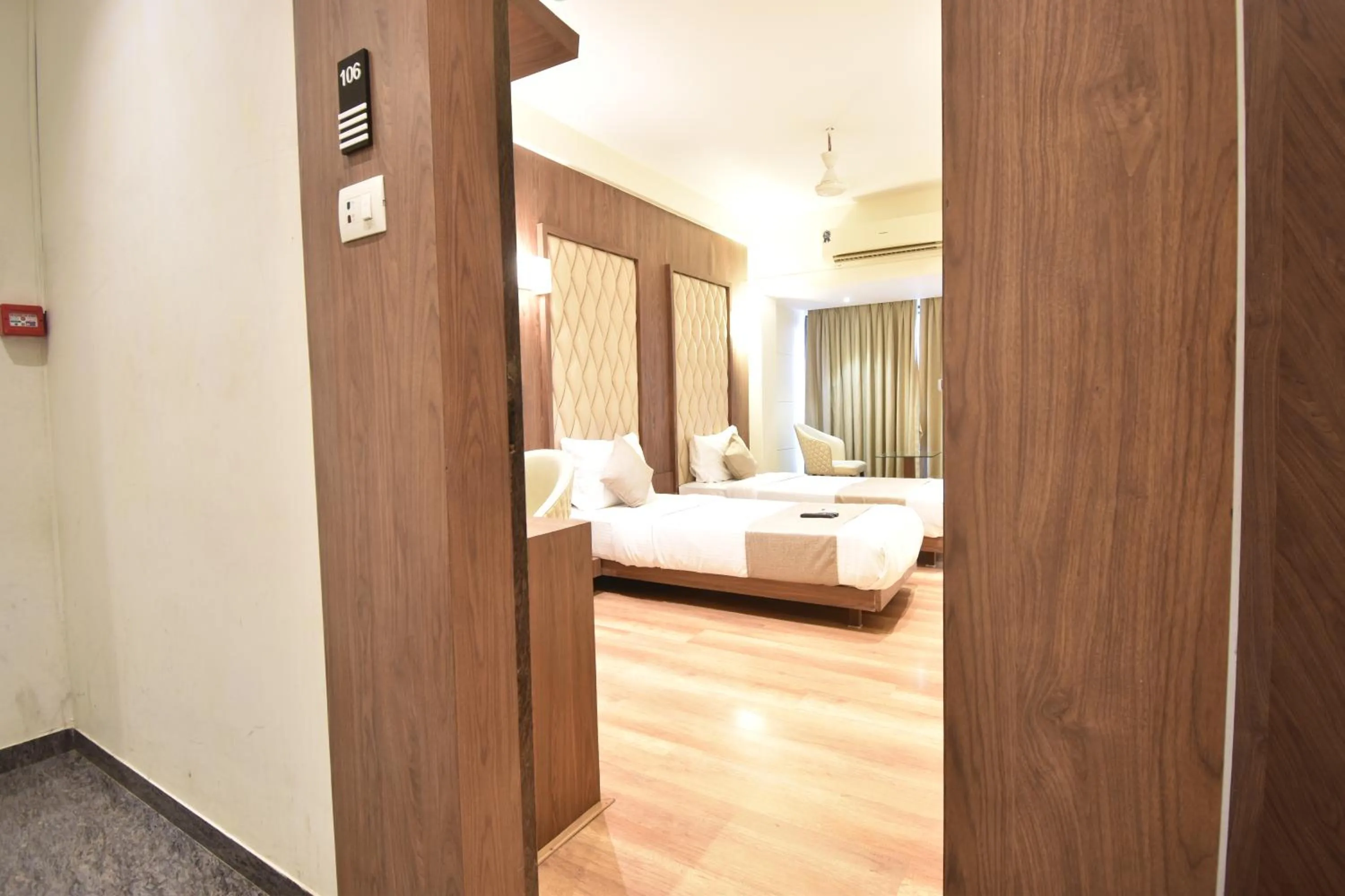 Bed in The Aarya A Smart Business Hotel