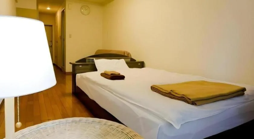 Bed in Itabashi Hotel Hilltop