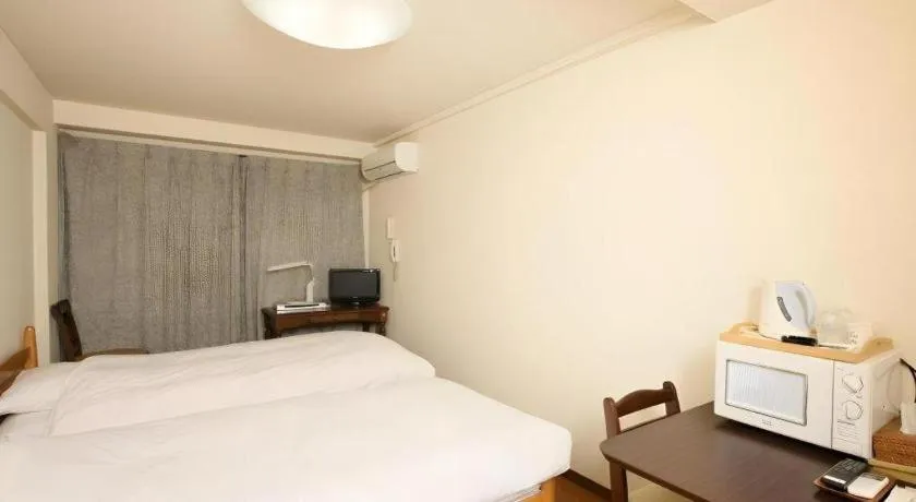 Bed in Itabashi Hotel Hilltop