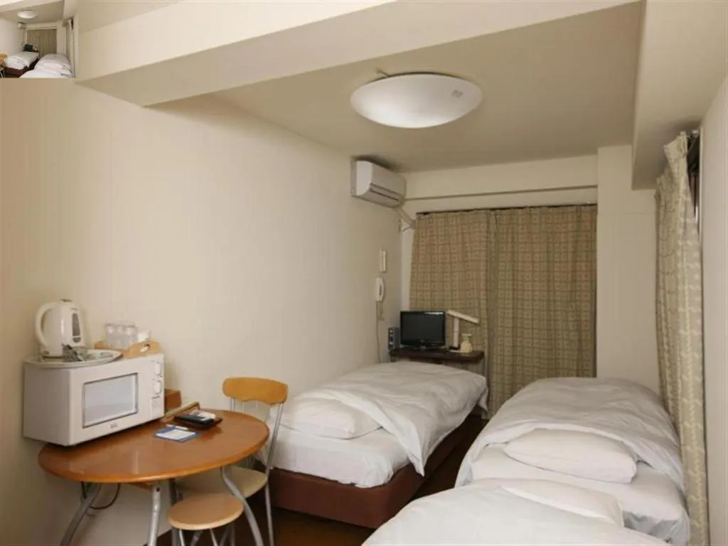 Bed in Itabashi Hotel Hilltop