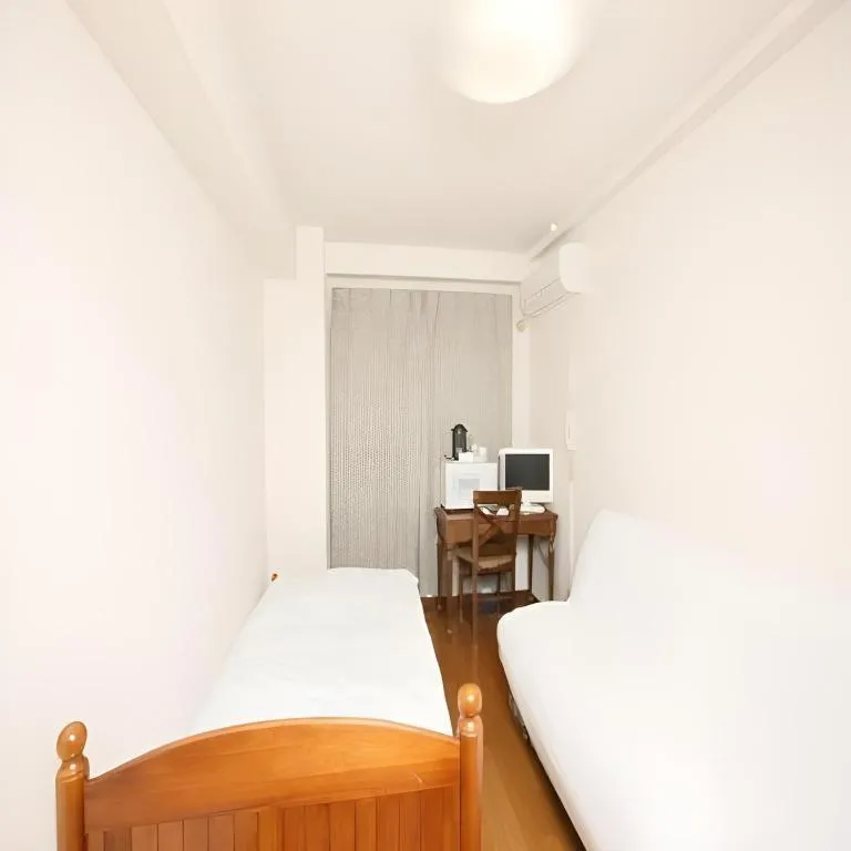 Bed in Itabashi Hotel Hilltop