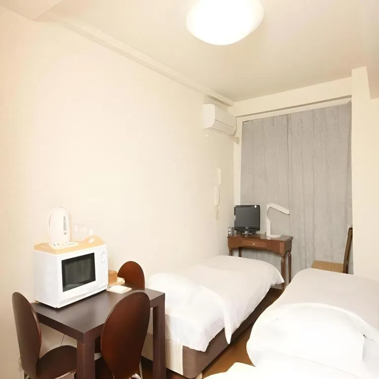 Bed in Itabashi Hotel Hilltop