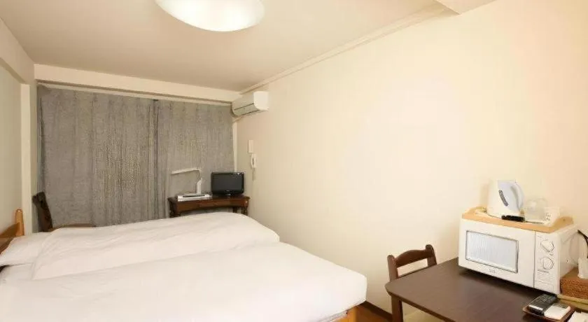 Bed in Itabashi Hotel Hilltop