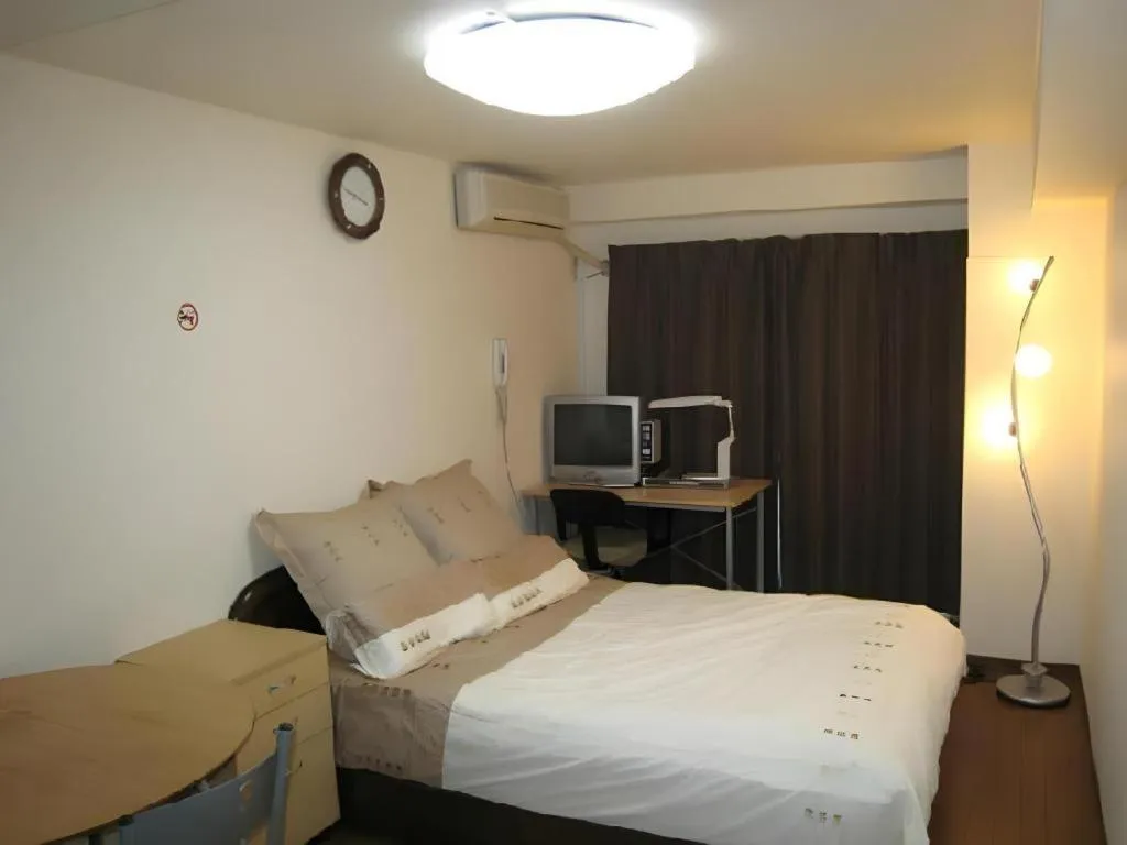 Bed in Itabashi Hotel Hilltop