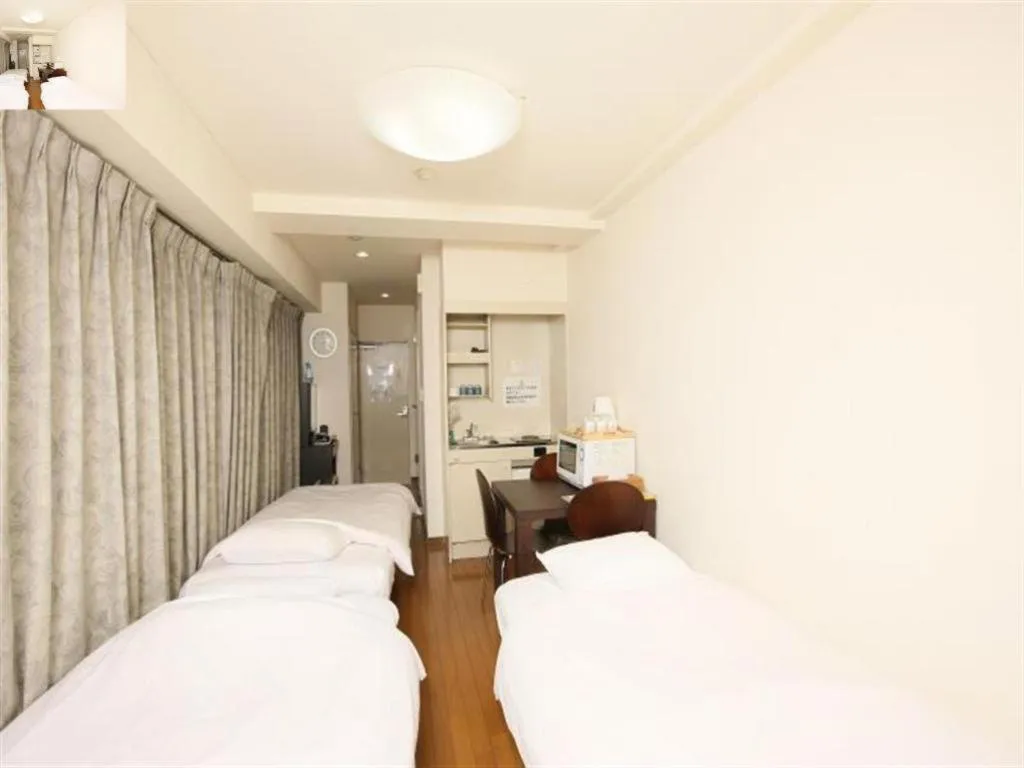 Bed in Itabashi Hotel Hilltop