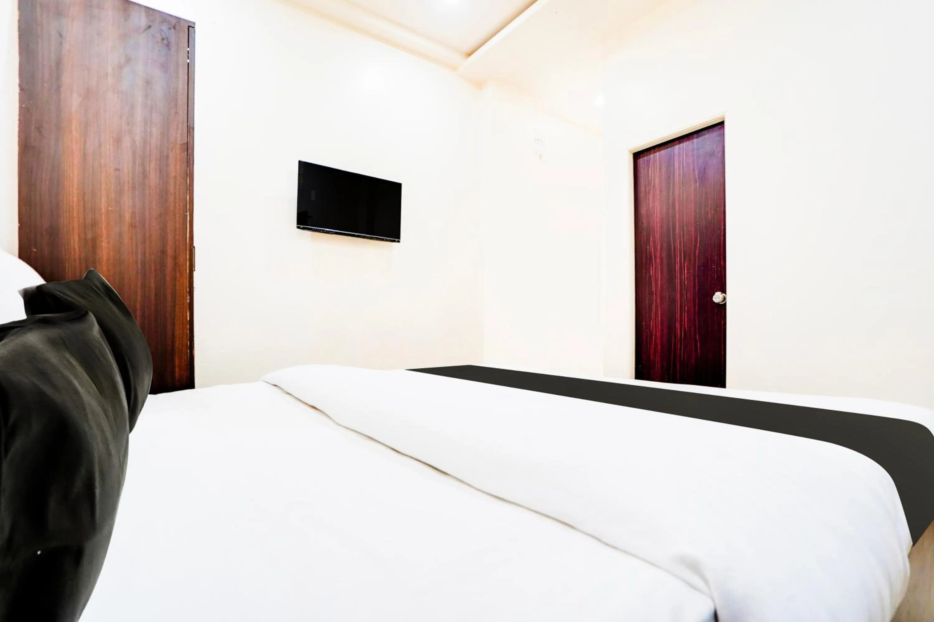 Bedroom in Hotel O UTS STAY IN