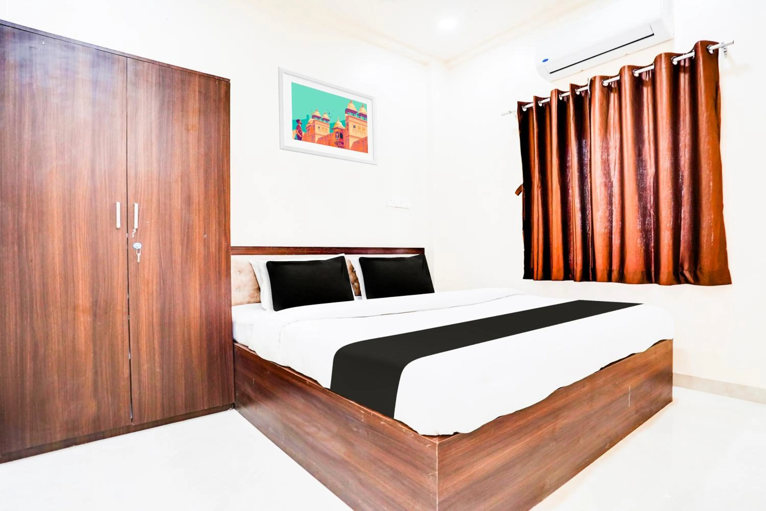 Bedroom in Hotel O UTS STAY IN