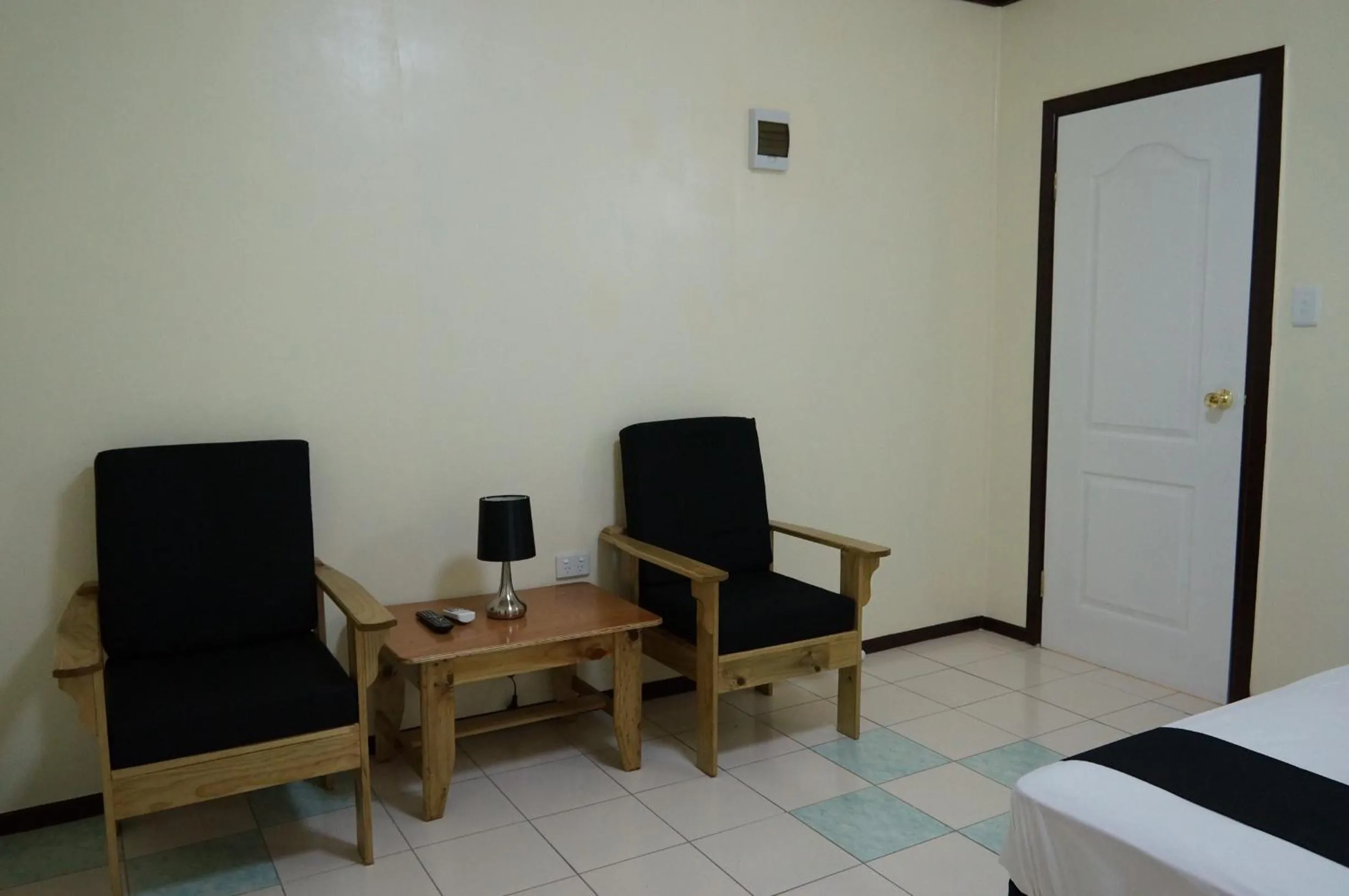 Seating area, Bed in Moatoga Hotel
