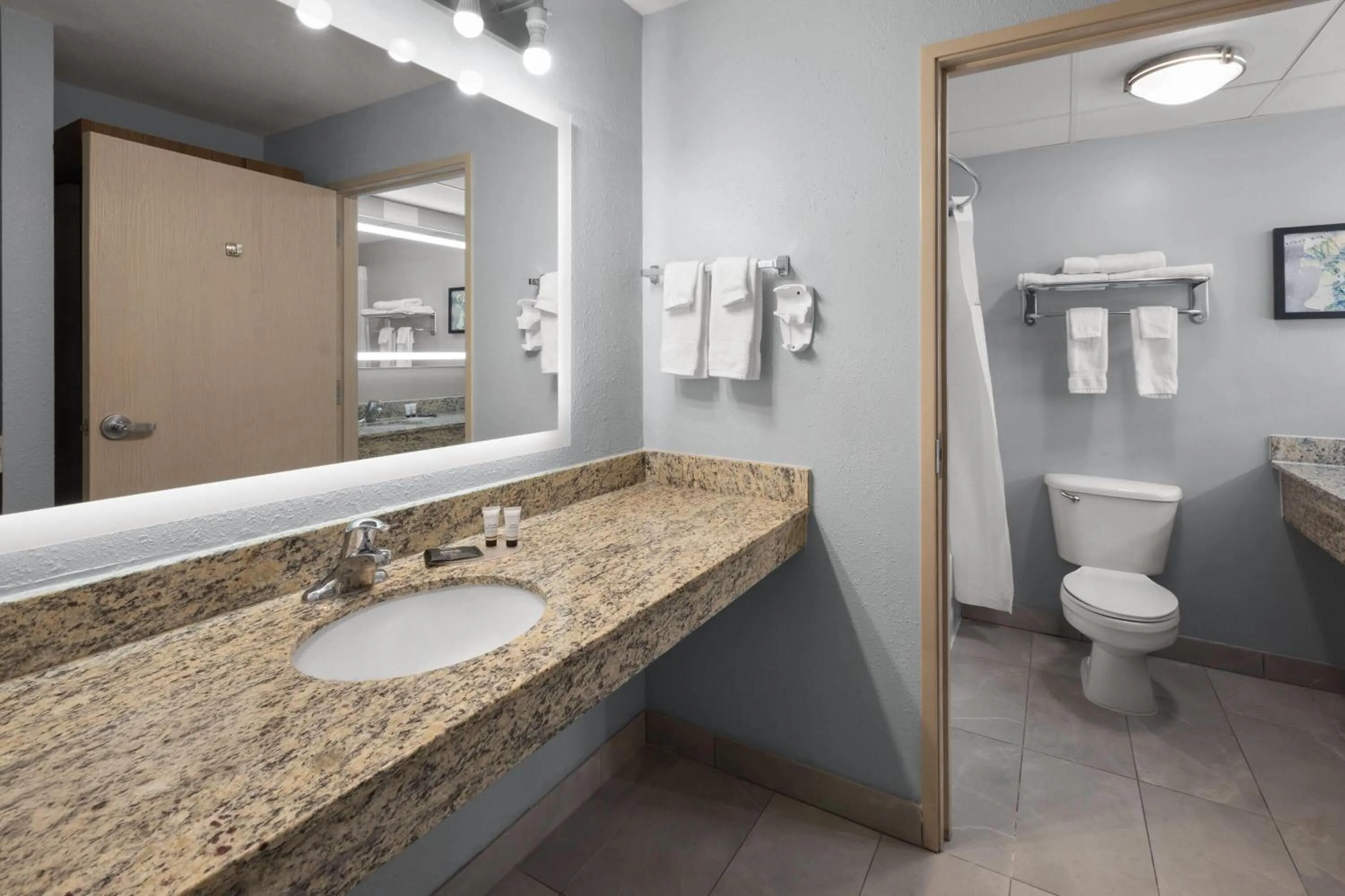 Bathroom in AmericInn by Wyndham Douglas/Saugatuck