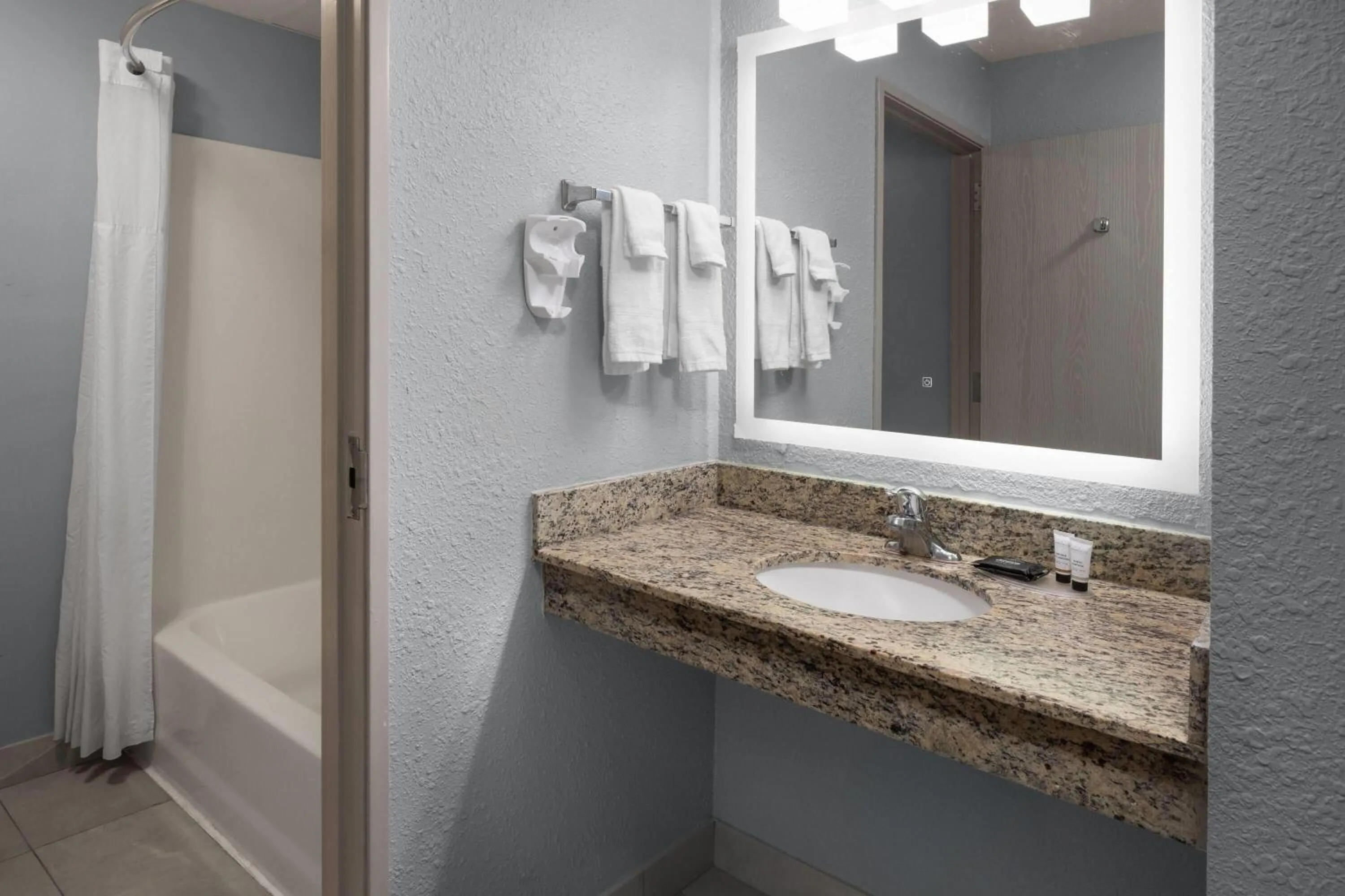 Bathroom in AmericInn by Wyndham Douglas/Saugatuck