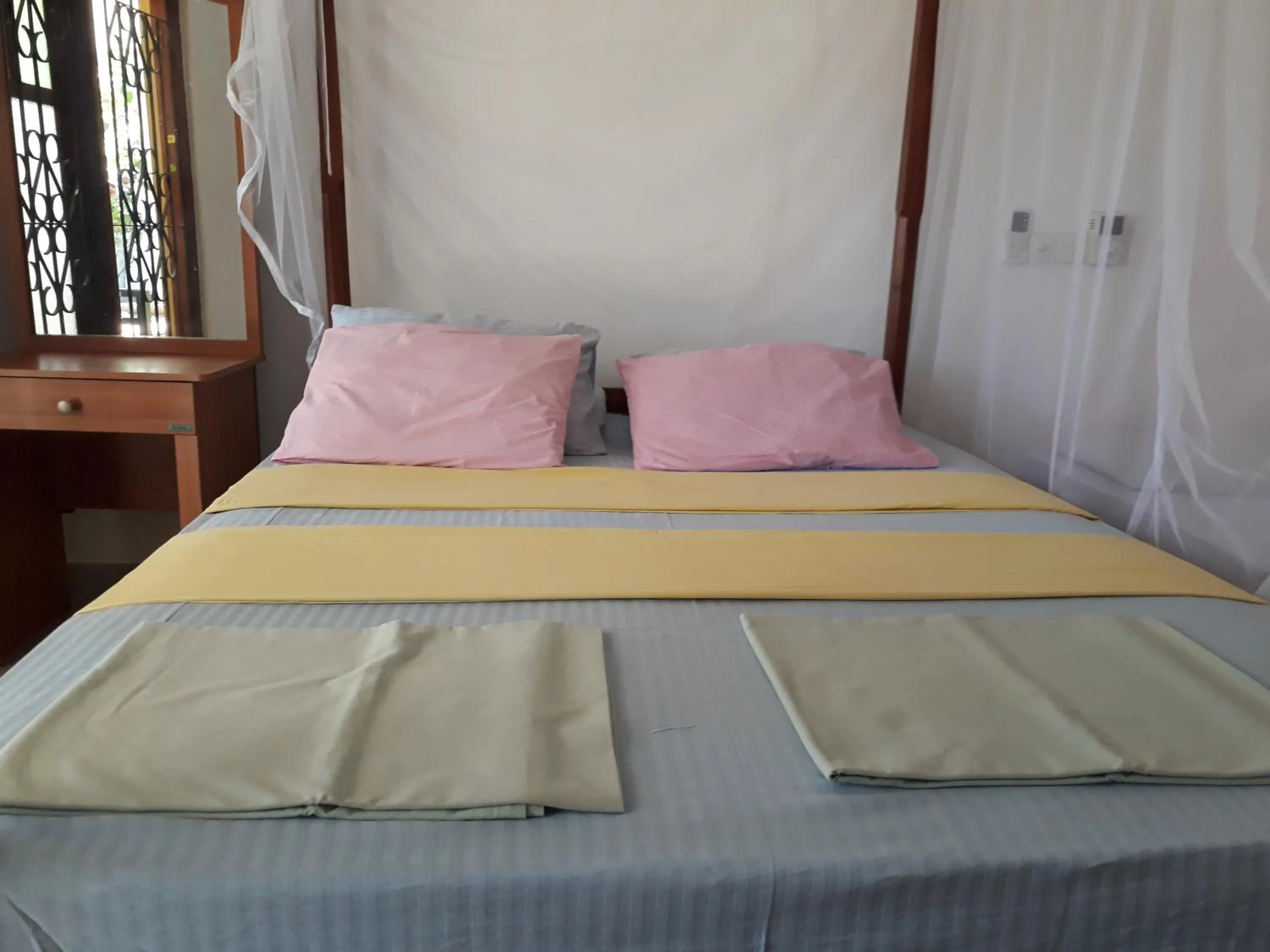 Bed in Traveller's Home Hotel