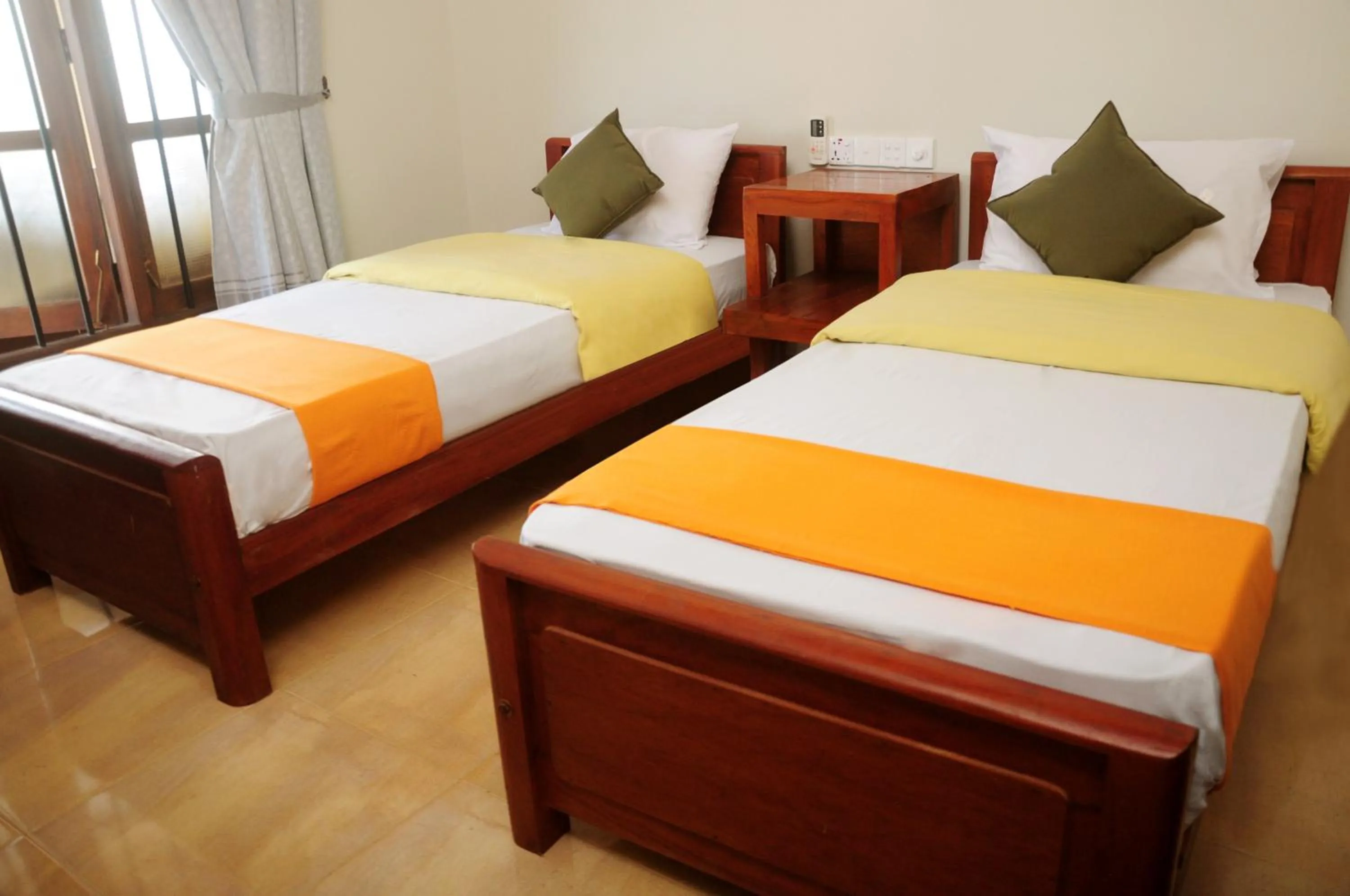 Bed in Traveller's Home Hotel