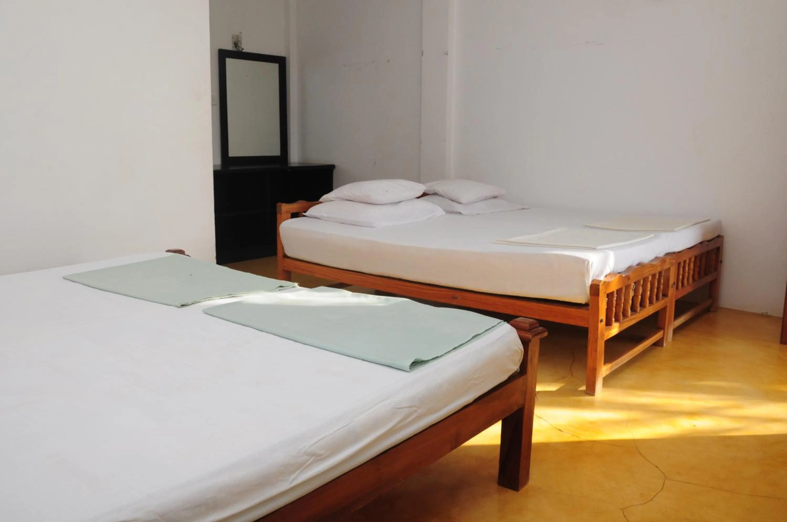 Photo of the whole room, Bed in Traveller's Home Hotel