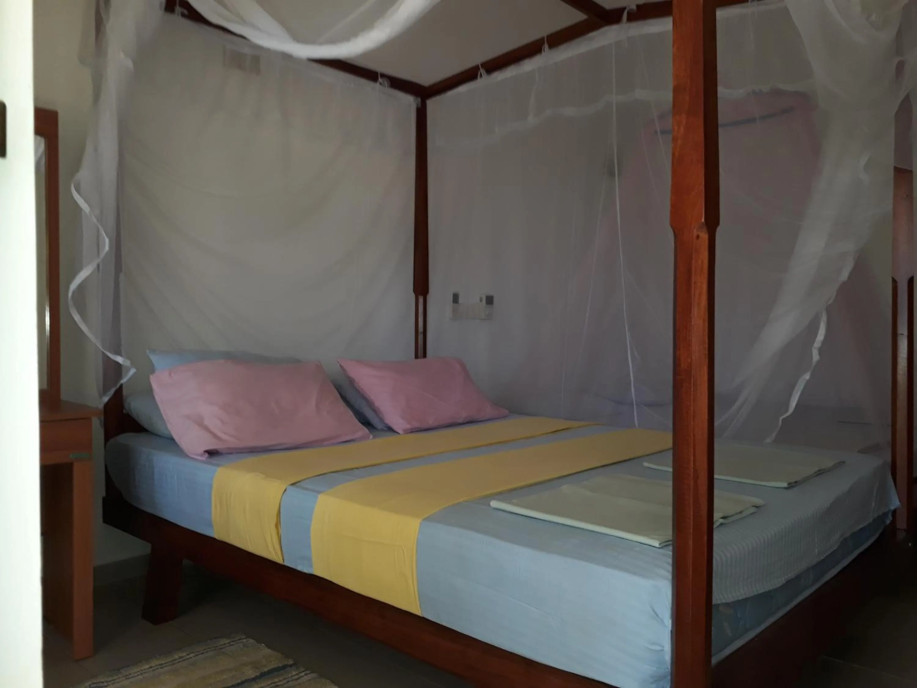 Bed in Traveller's Home Hotel