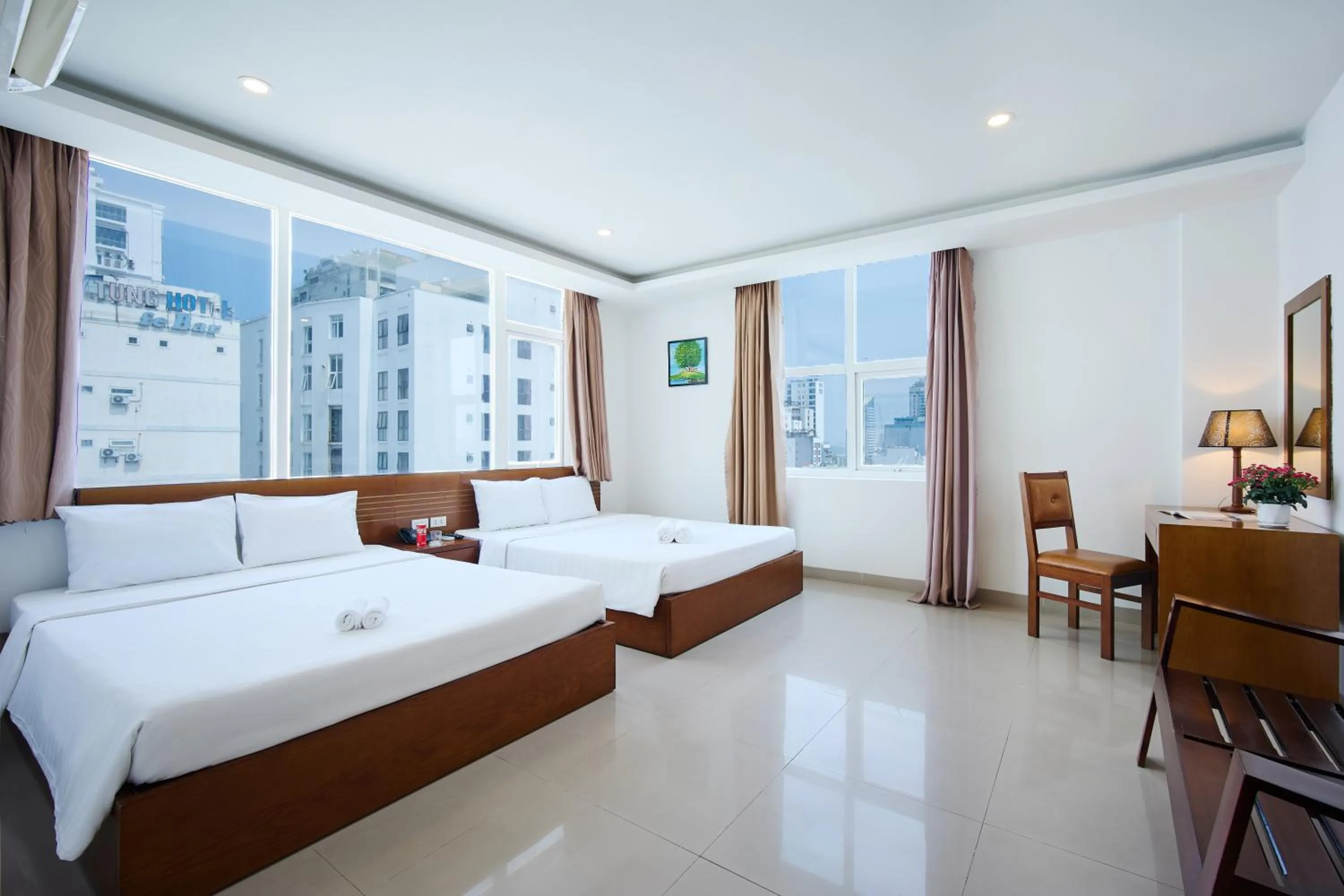 Bed in Golden Light Da Nang Hotel