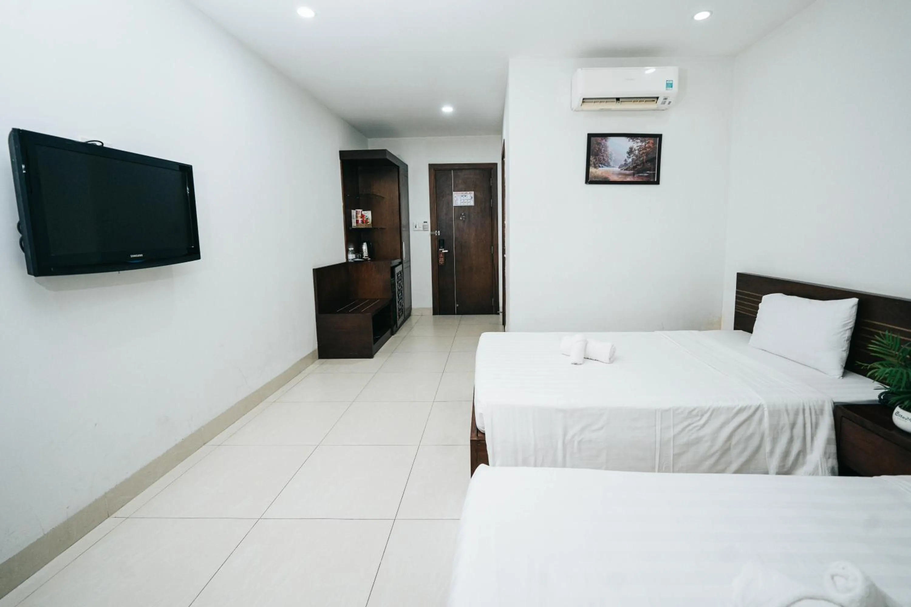 Bed in Golden Light Da Nang Hotel