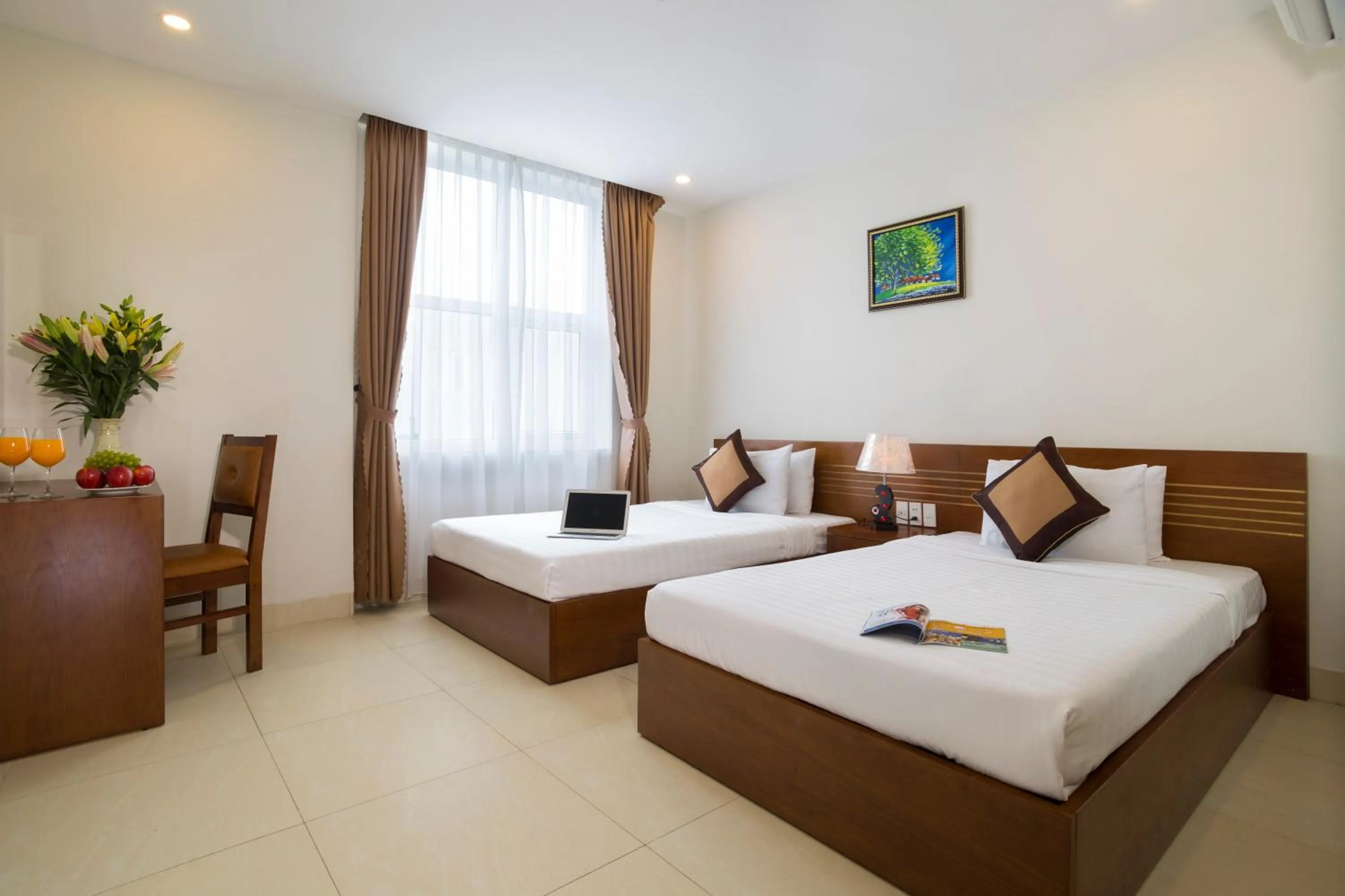 Bed in Golden Light Da Nang Hotel