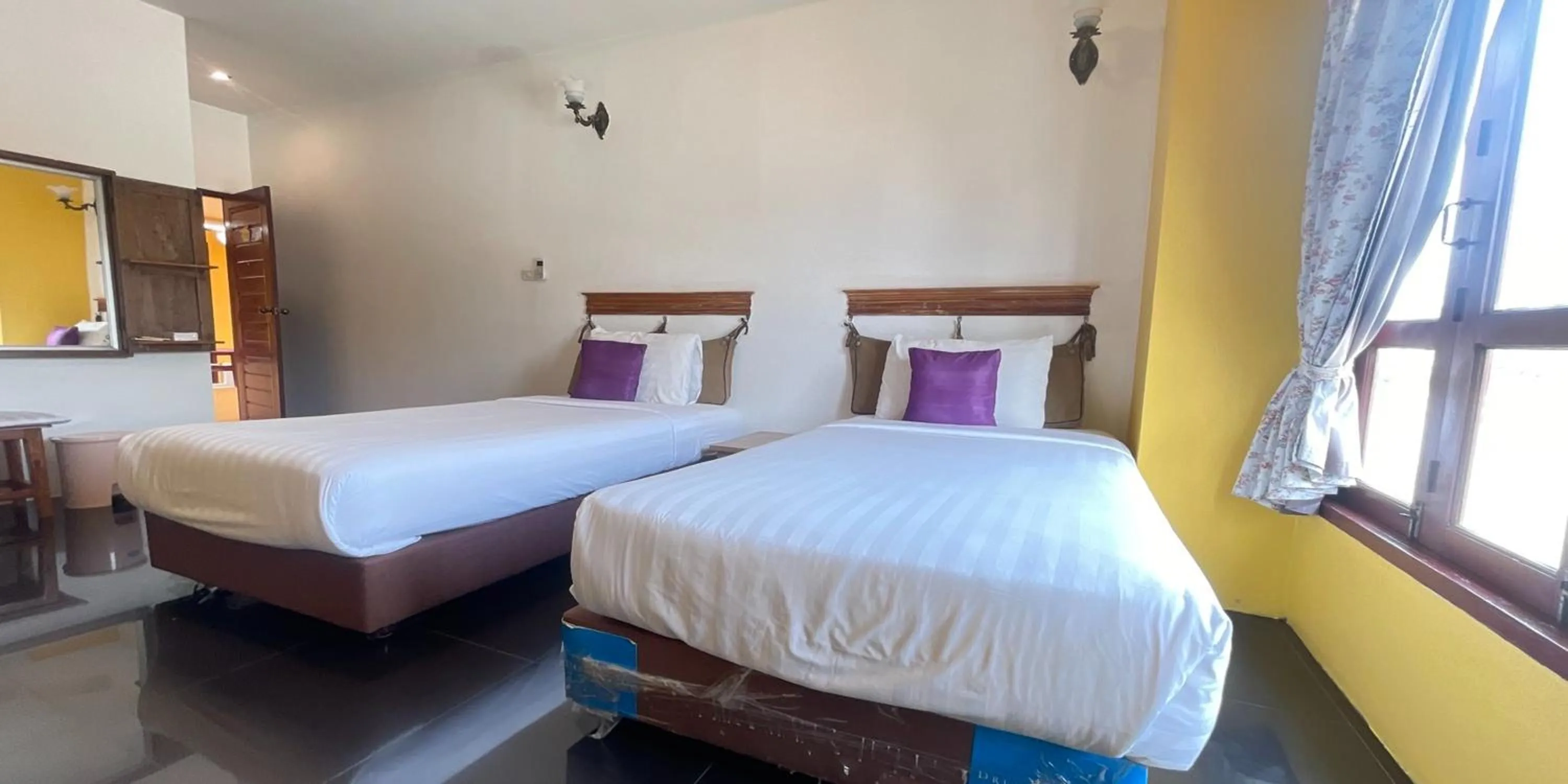 Bed in Yellow Tique Hotel