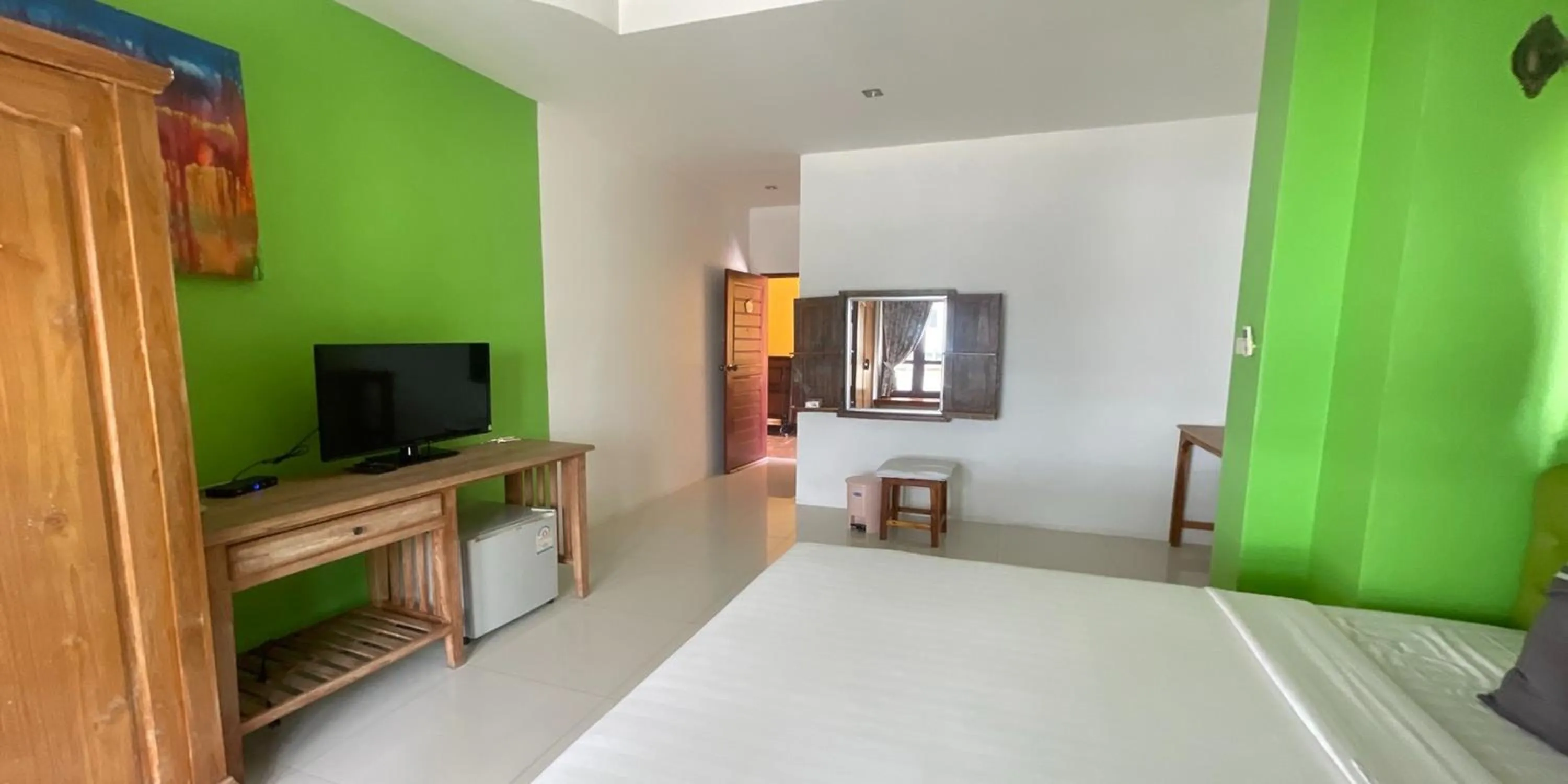 Bed in Yellow Tique Hotel