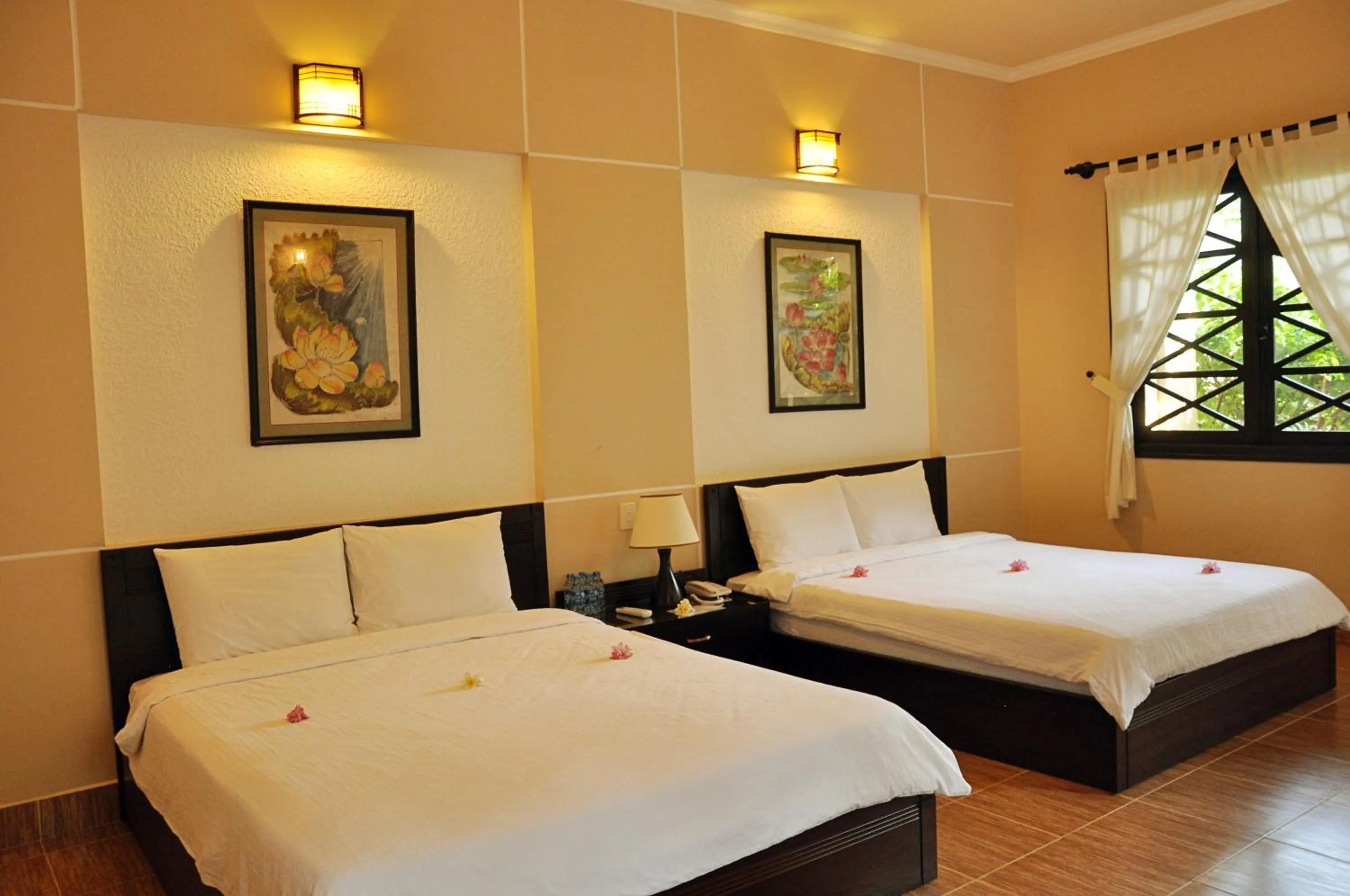 Bed in Orchid Boutique Beach Resort