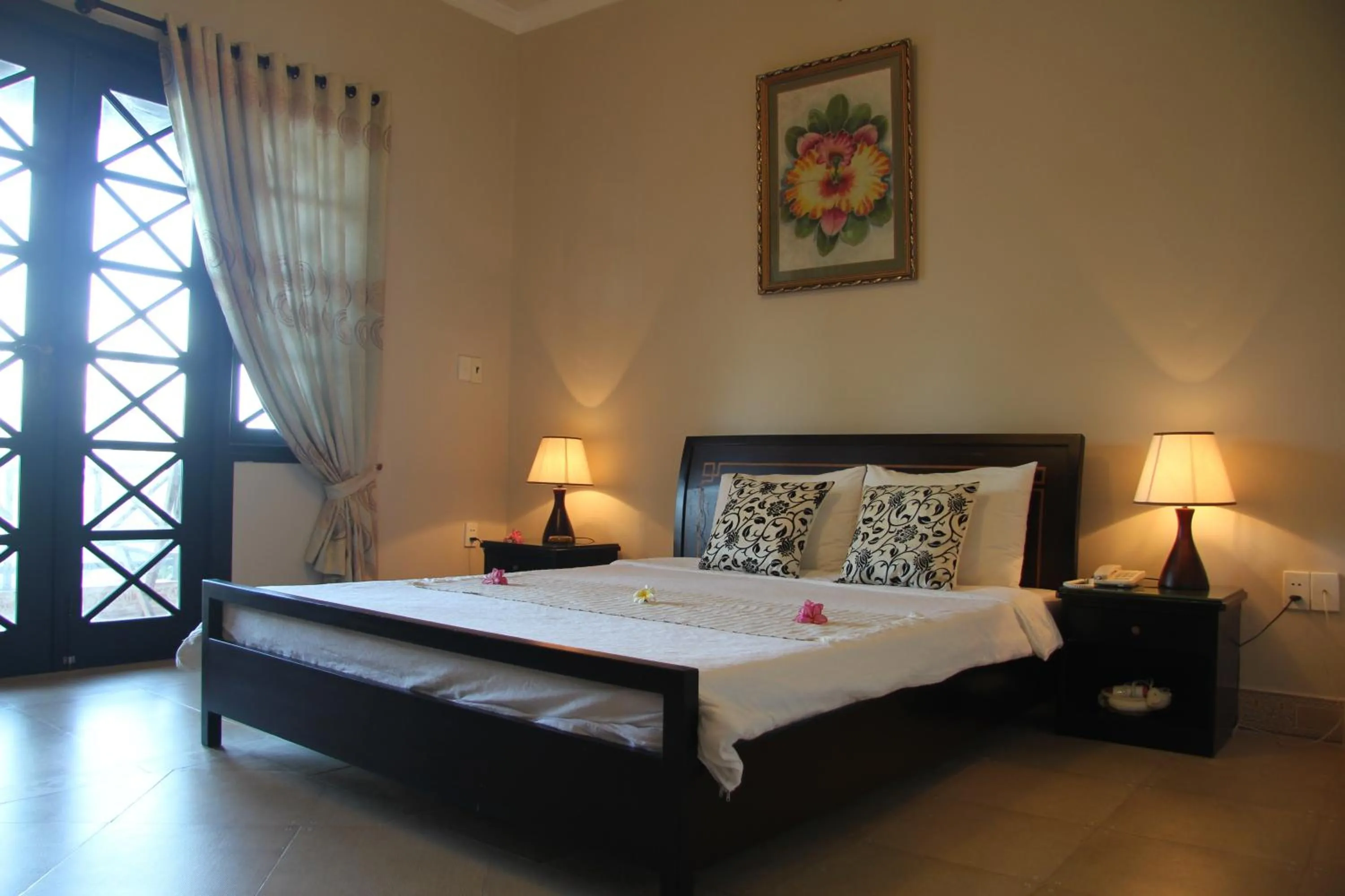 Bed in Orchid Boutique Beach Resort