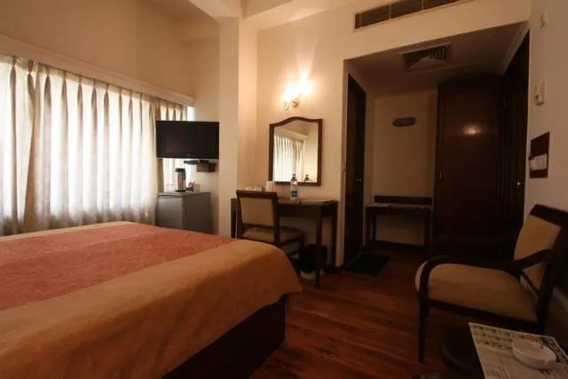Bed, TV/Entertainment Center in Hotel Crystal Palace Meerut