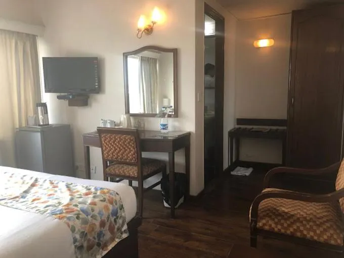 Toilet, TV/Entertainment Center in Hotel Crystal Palace Meerut