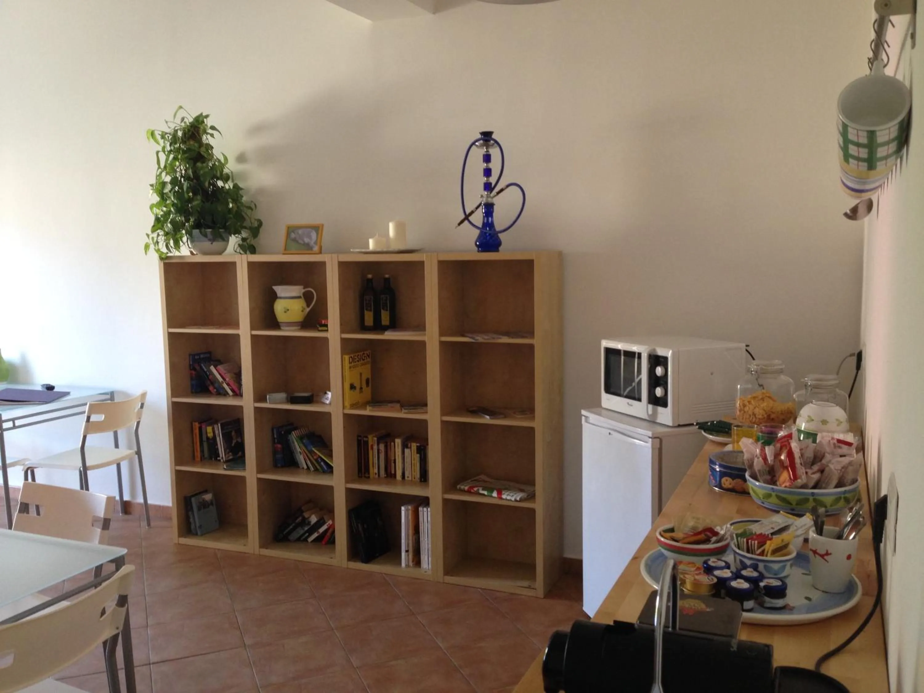 Communal lounge/ TV room in B&B La Gatta Bianca