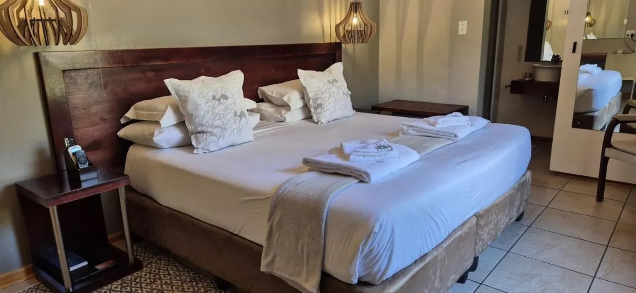 Bedroom, Bed in Elegant Lodge & Conference Center