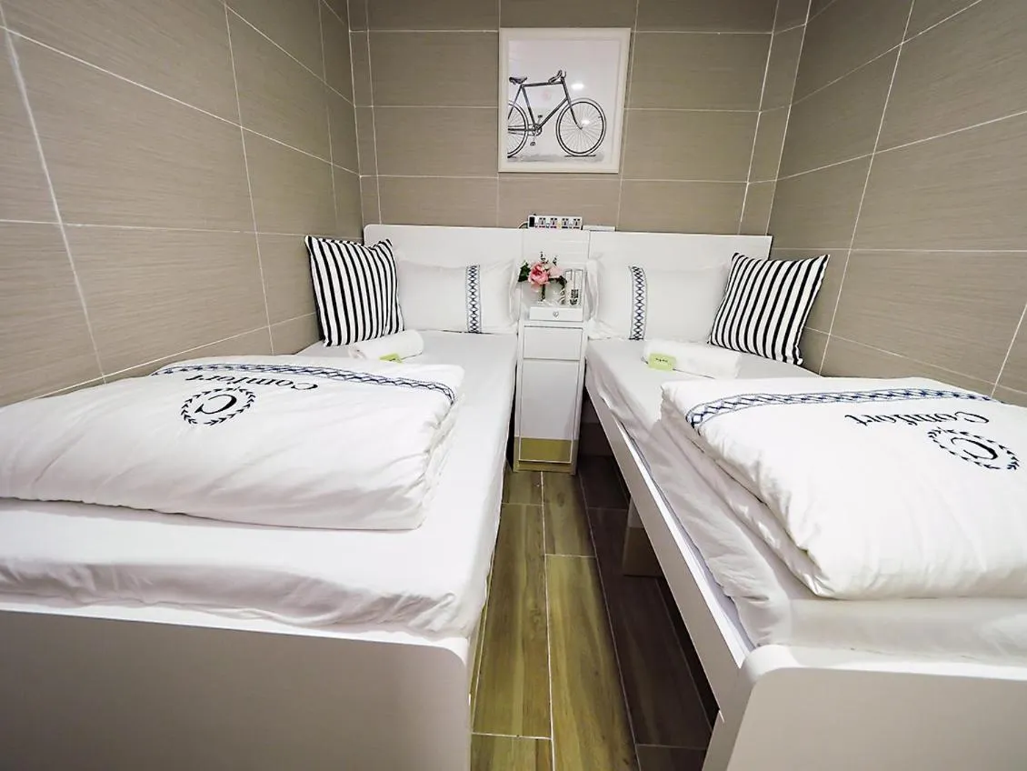 Bed in Joyous Guest House