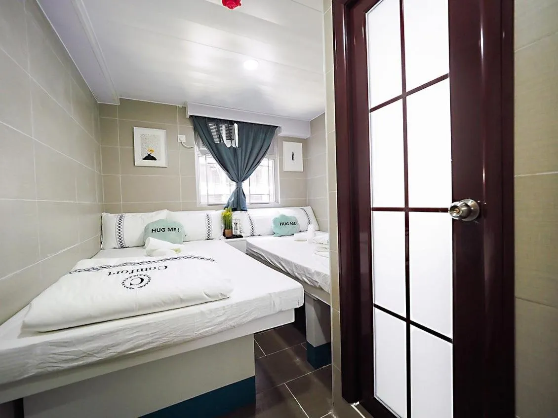 Bed in Joyous Guest House