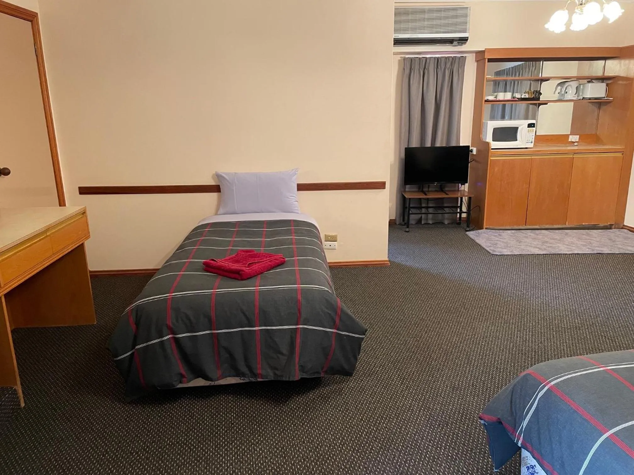 Bed in True blue Motor Inn