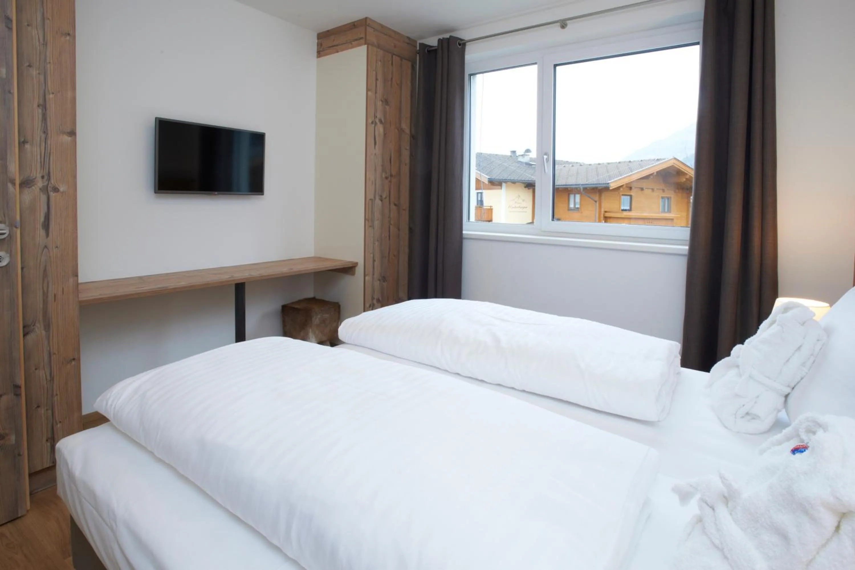 Bed in Ski & Golf Suites Zell am See by Alpin Rentals