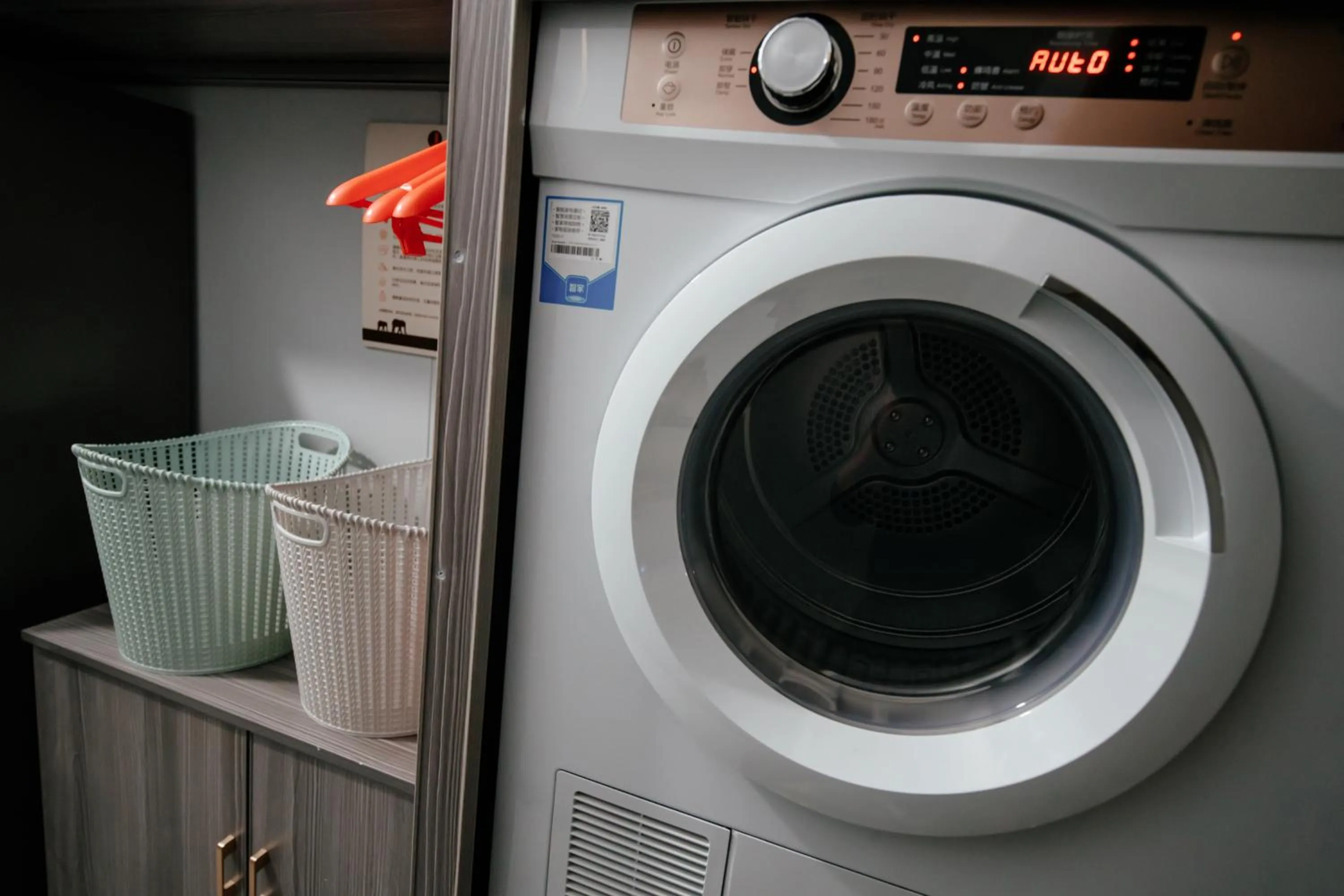 washing machine in Orient Rose International Hotel
