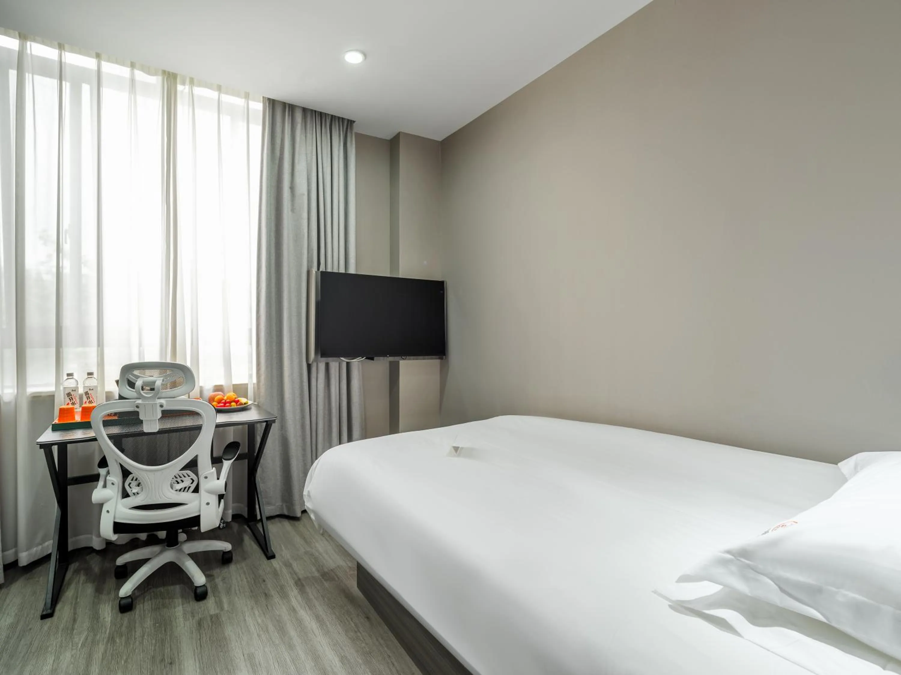 Bed in Orient Rose International Hotel