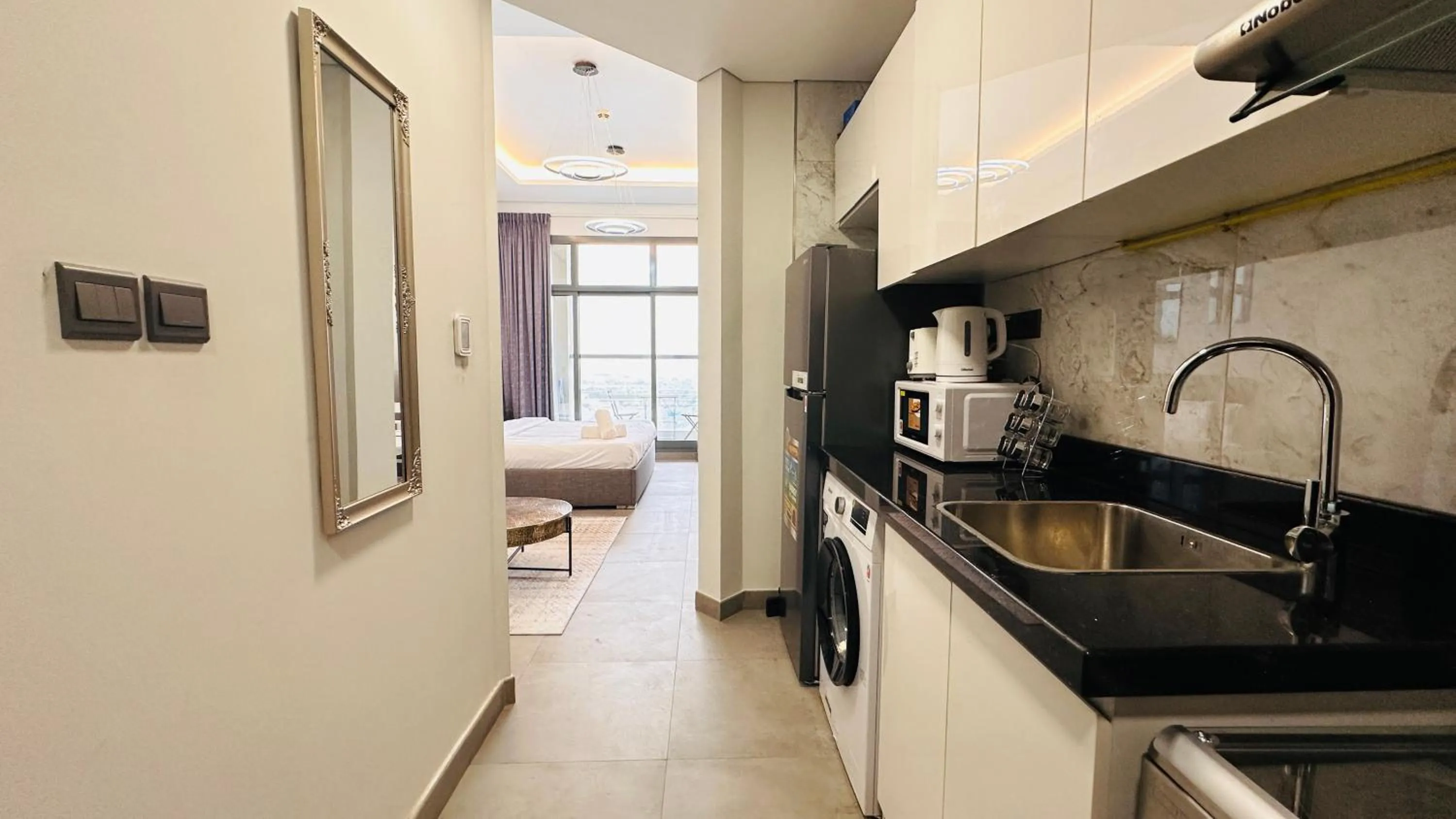 Kitchen or kitchenette in Upscale Studio Apartment Burj View with Balcony Free Parking by Belvilla