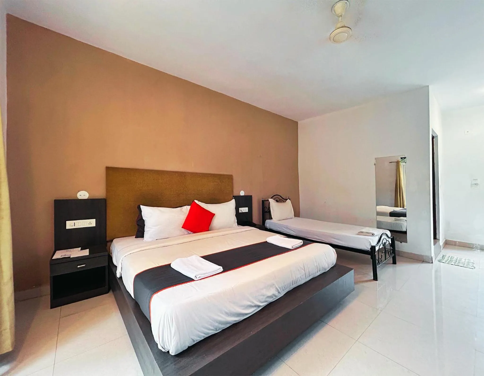 Bed in Bay Breeze Resorts & Hotels