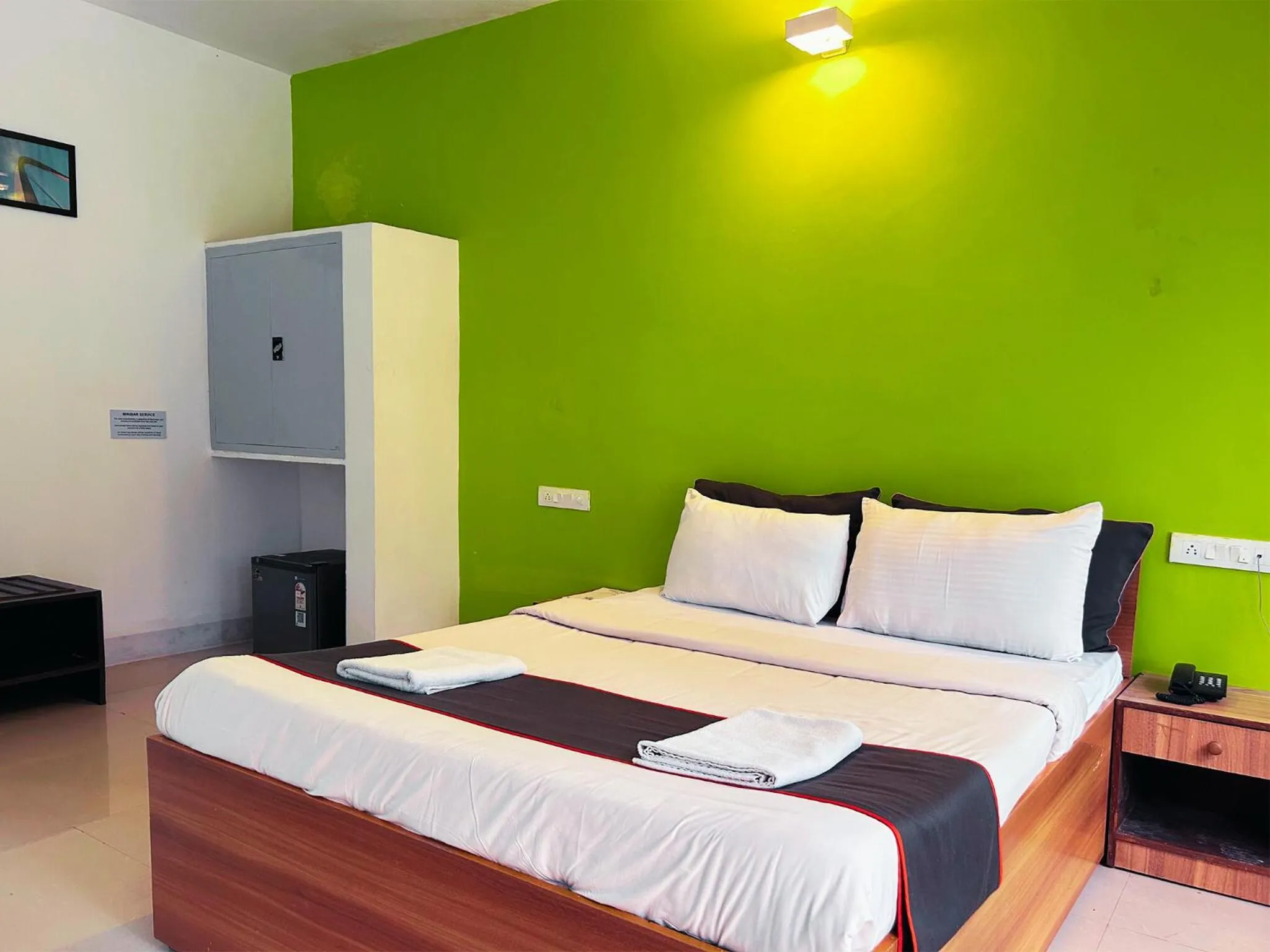 Bed in Bay Breeze Resorts & Hotels