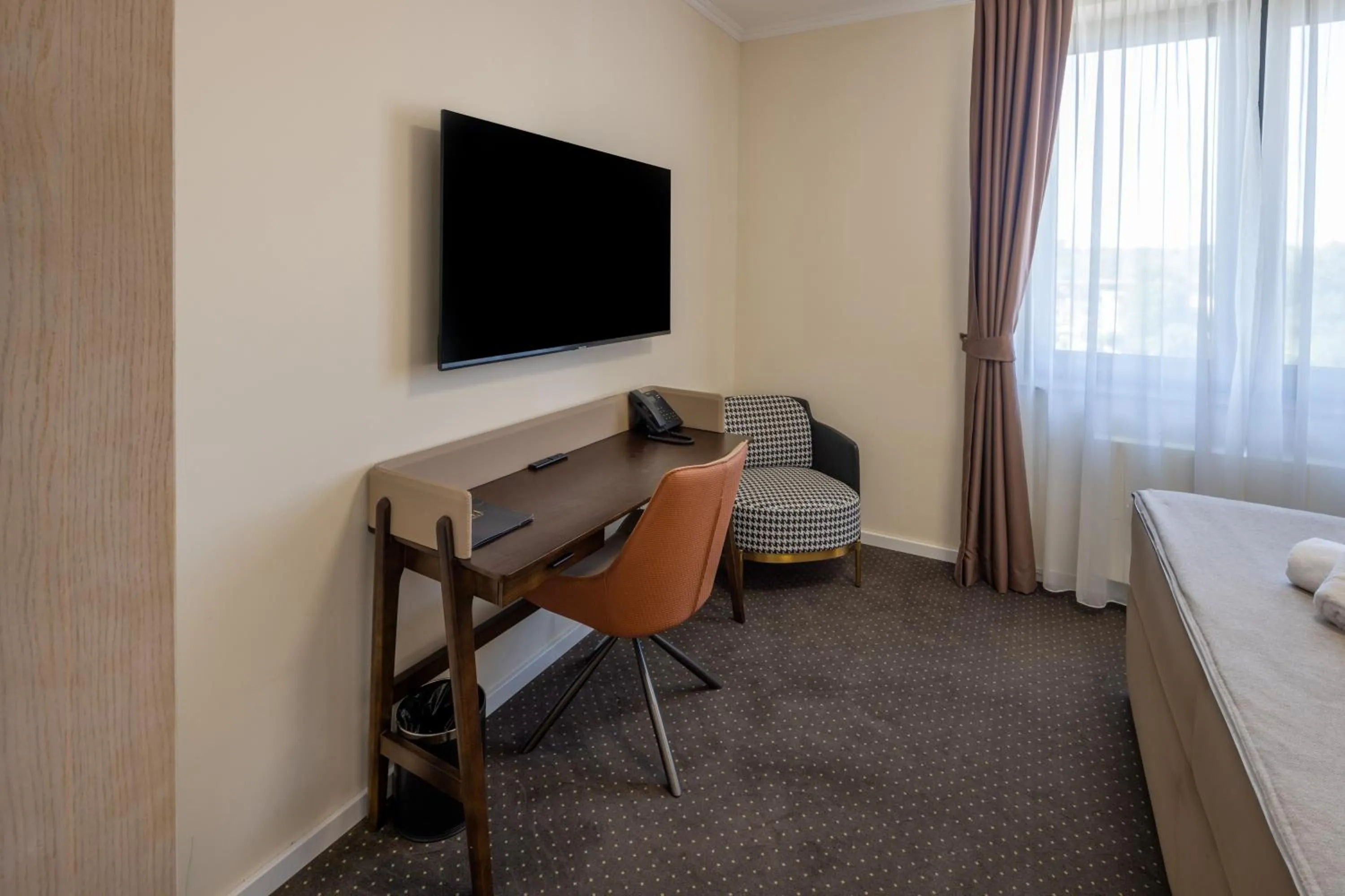 Seating area, Bed in Nobel West Hotel