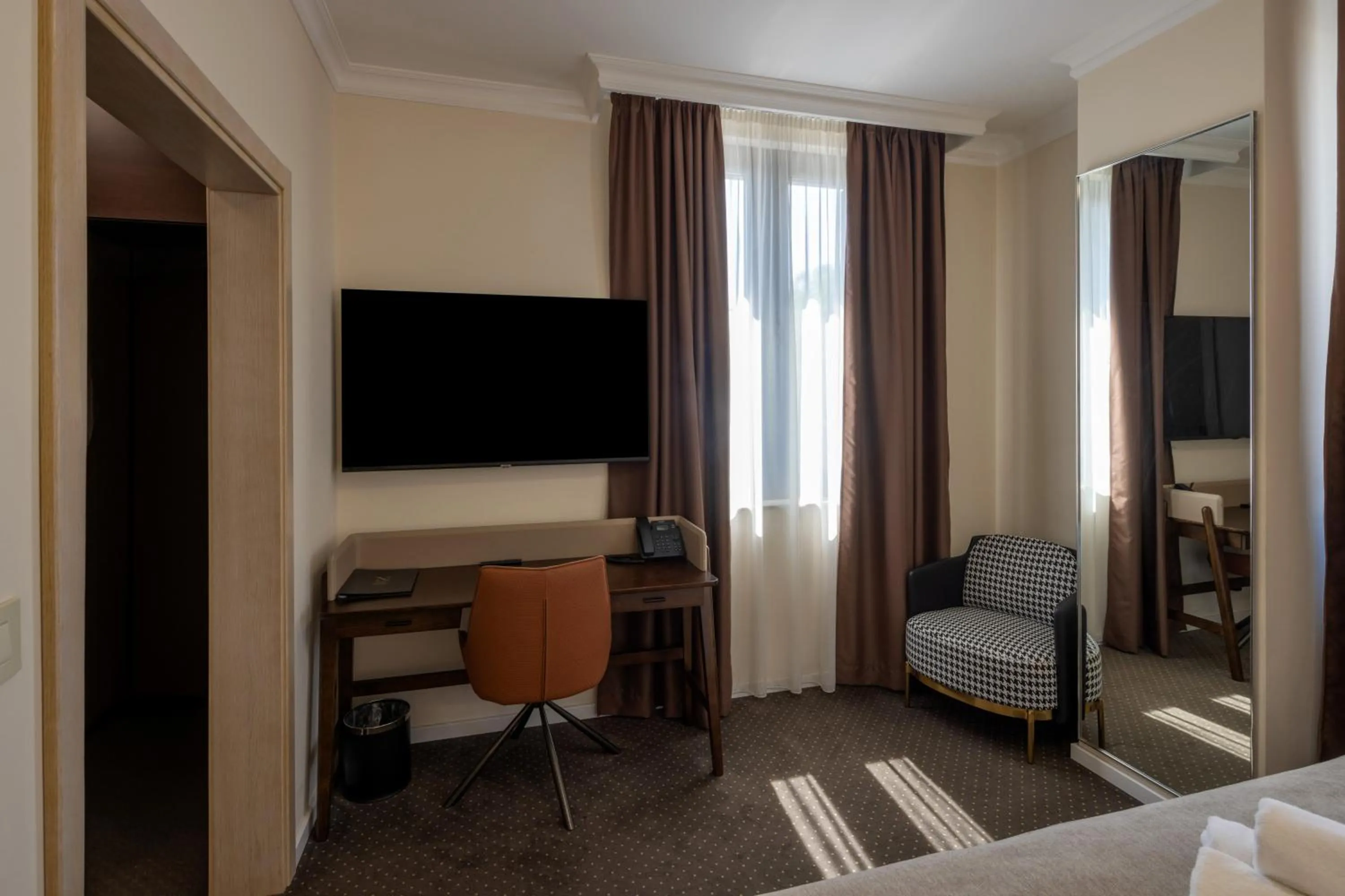 Seating area, Bed in Nobel West Hotel