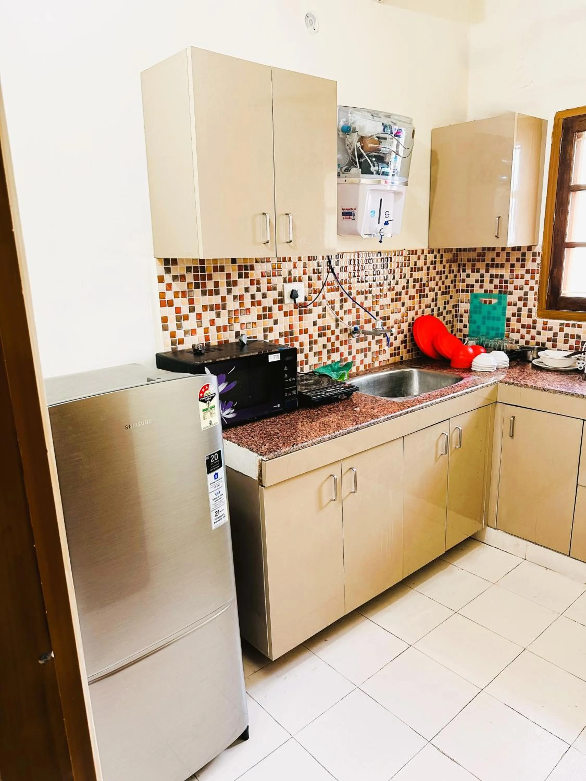Kitchen or kitchenette in ZoomStay - 3BHK Apartments