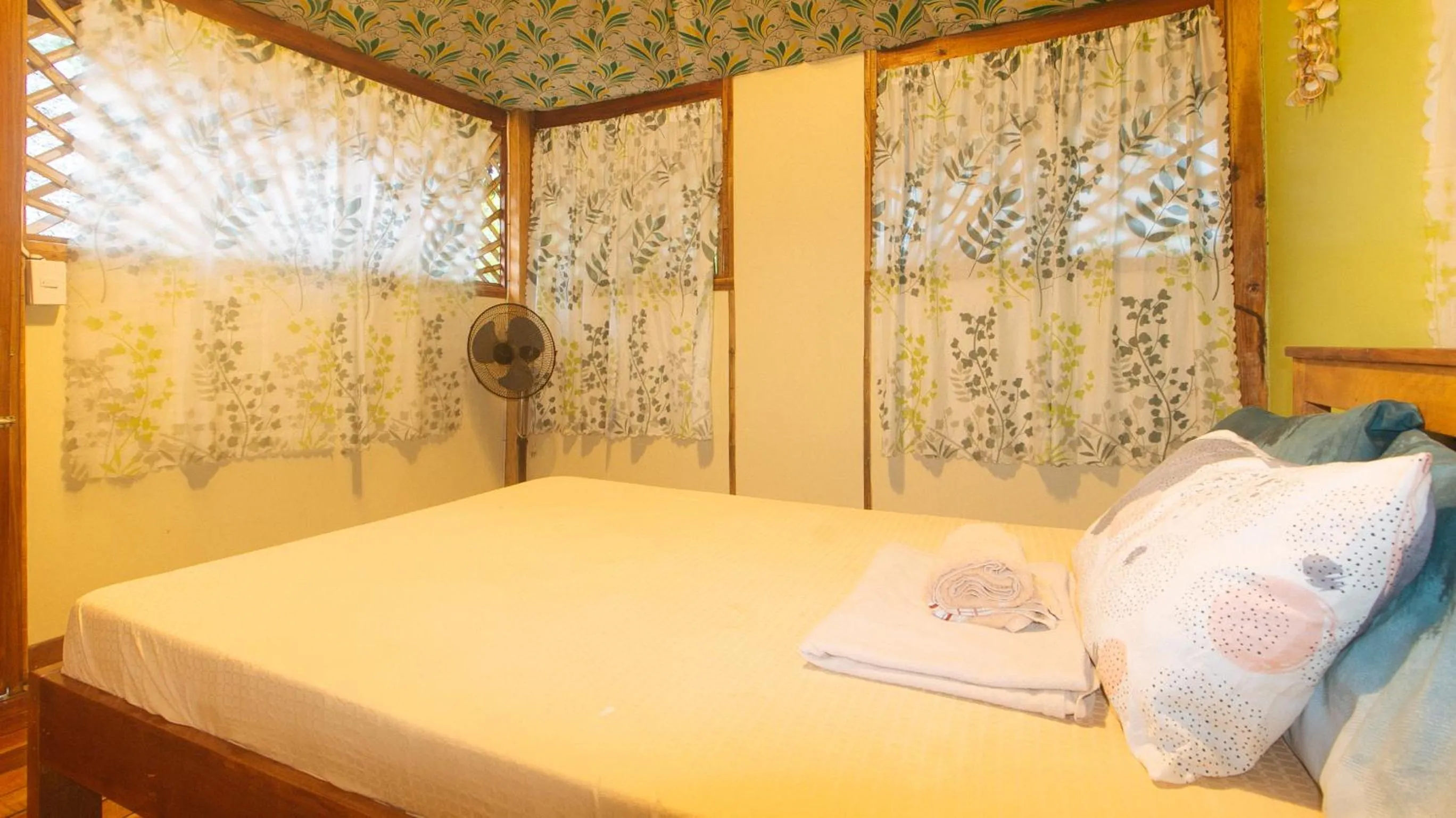 Bed in The Clara Beach and Guest House