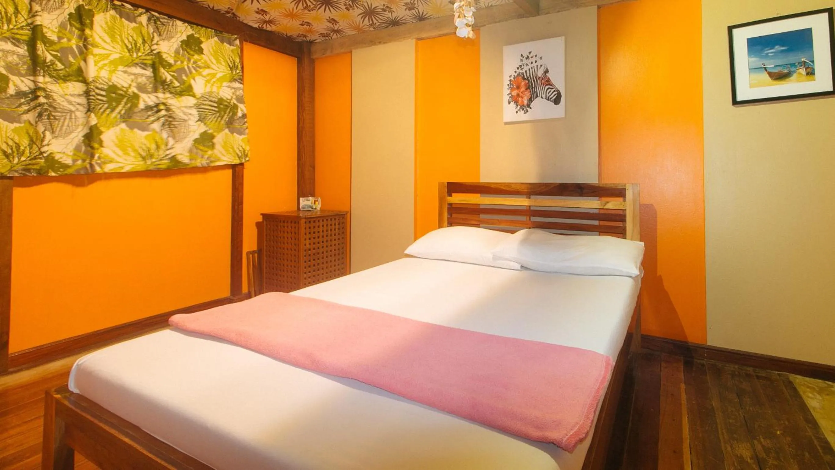 Bed in The Clara Beach and Guest House